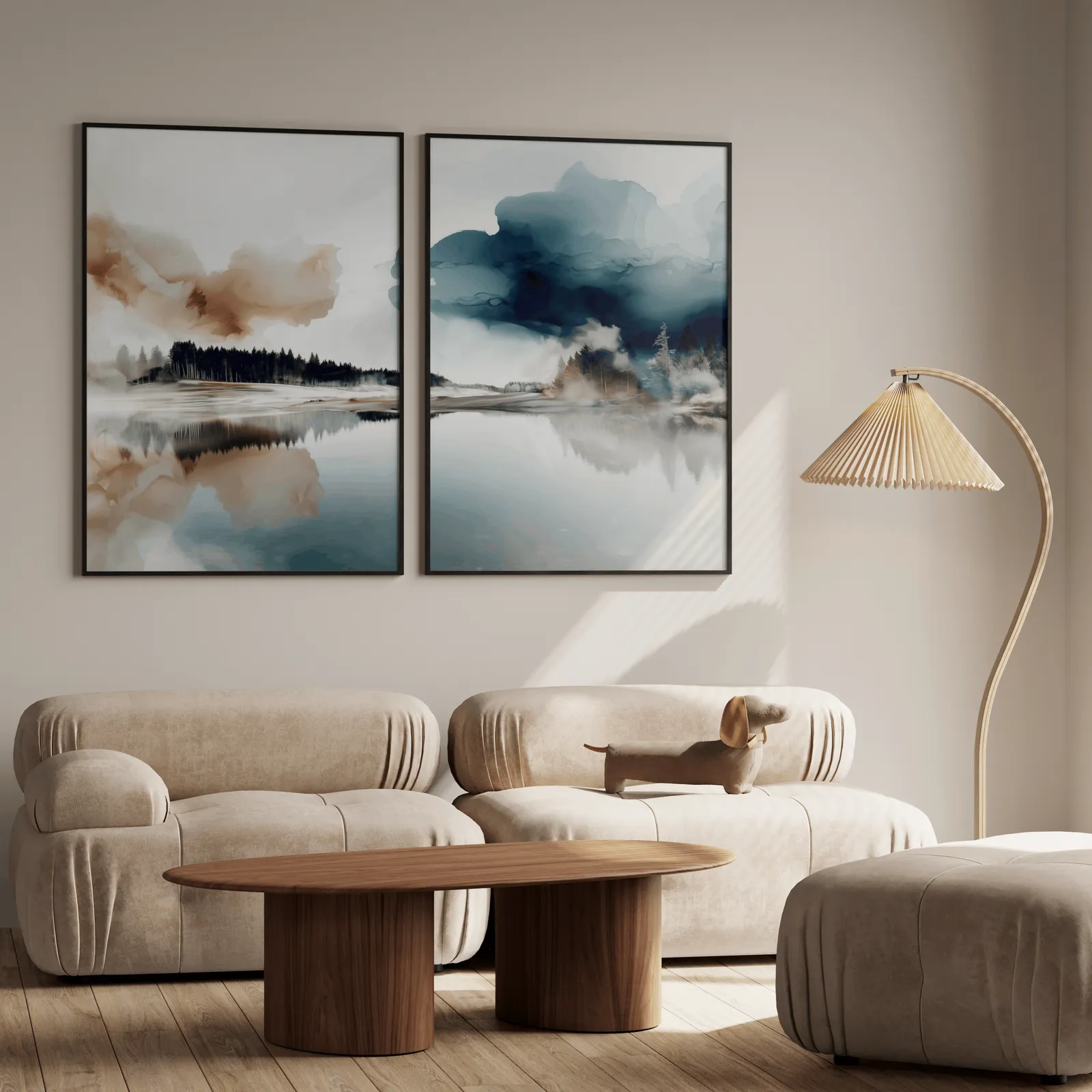 blue and brown misty forest landscape wall art set of 2, above a plush beige sofa with a pleated lamp nearby