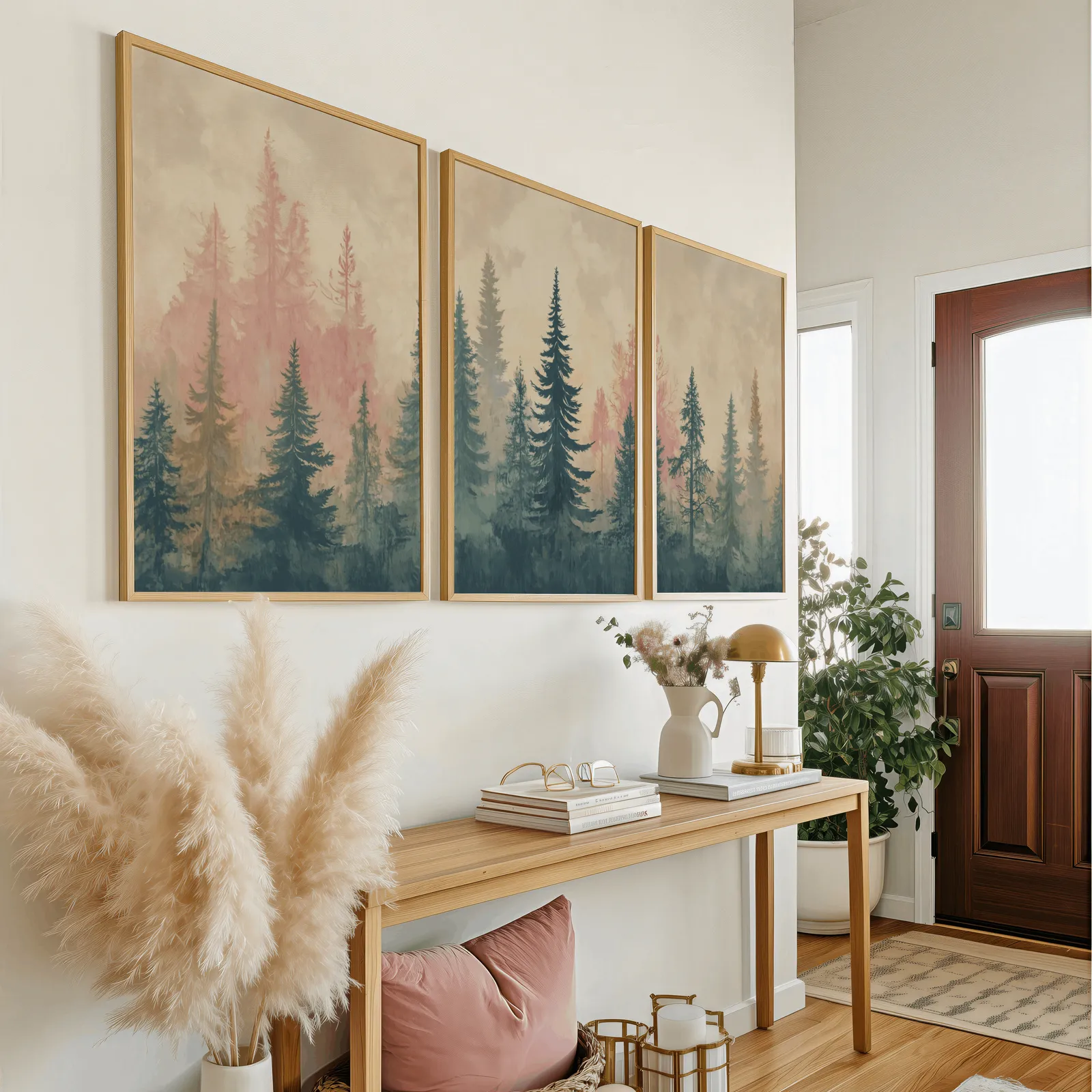 misty forest triptych wall art in pink and blue, above a wooden console table near the entry door