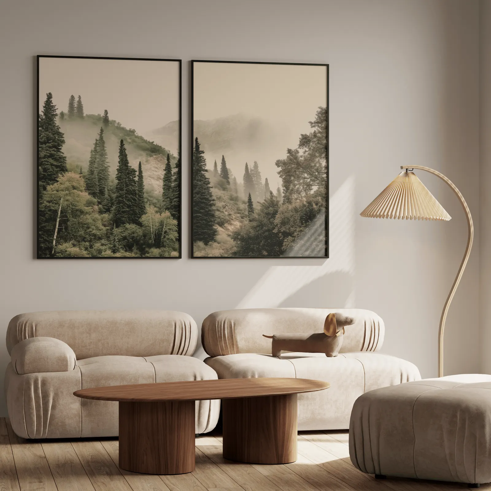misty forest wall art set of two pine hillside prints, above a plush beige sofa with a pleated lamp nearby