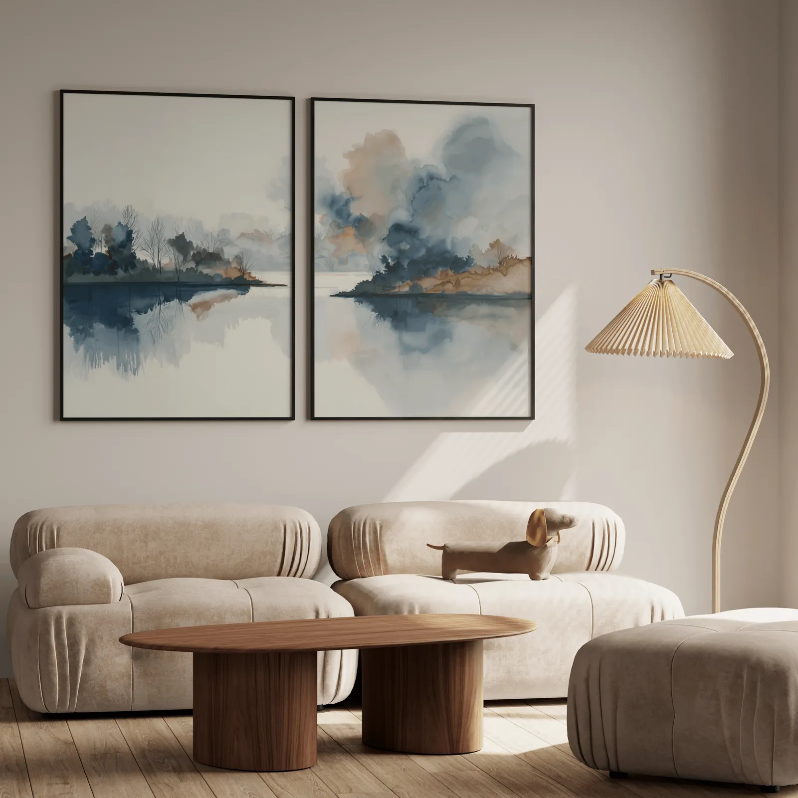 blue and gold misty lake landscape wall art set of two, above a plush beige sofa with a pleated lamp nearby