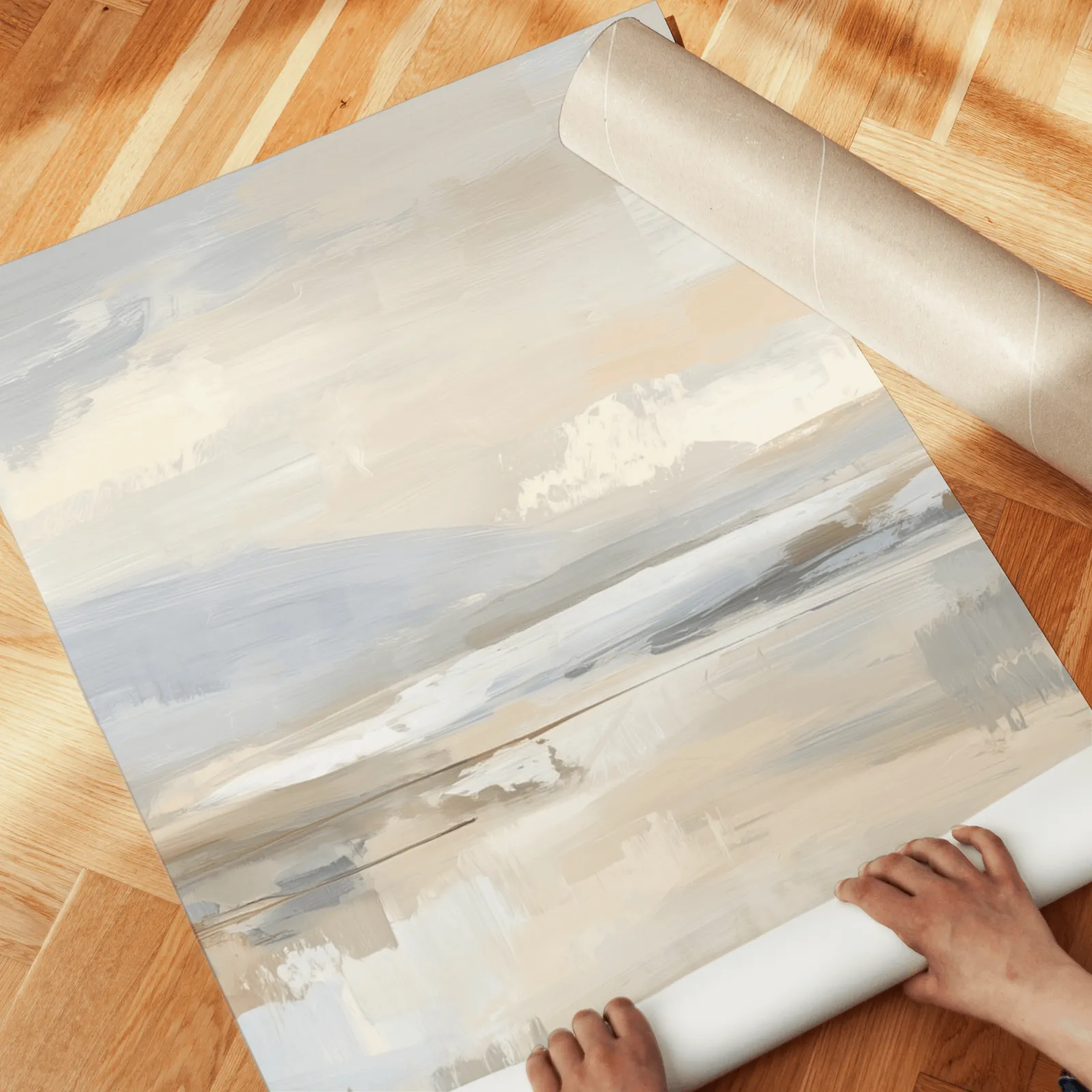 neutral abstract landscape wall art set of three, unrolled across a herringbone wood floor by hand