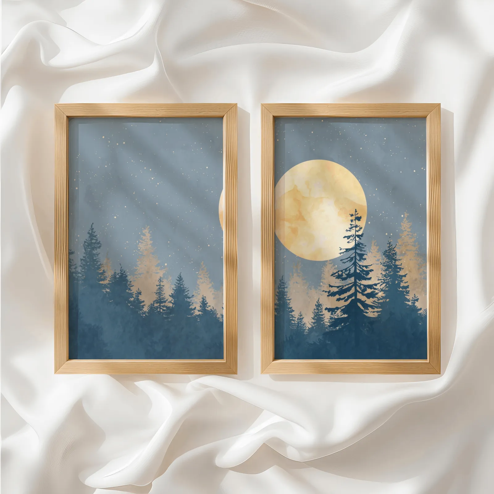 blue pine tree wall art set with golden moon, side by side atop rumpled white silky fabric