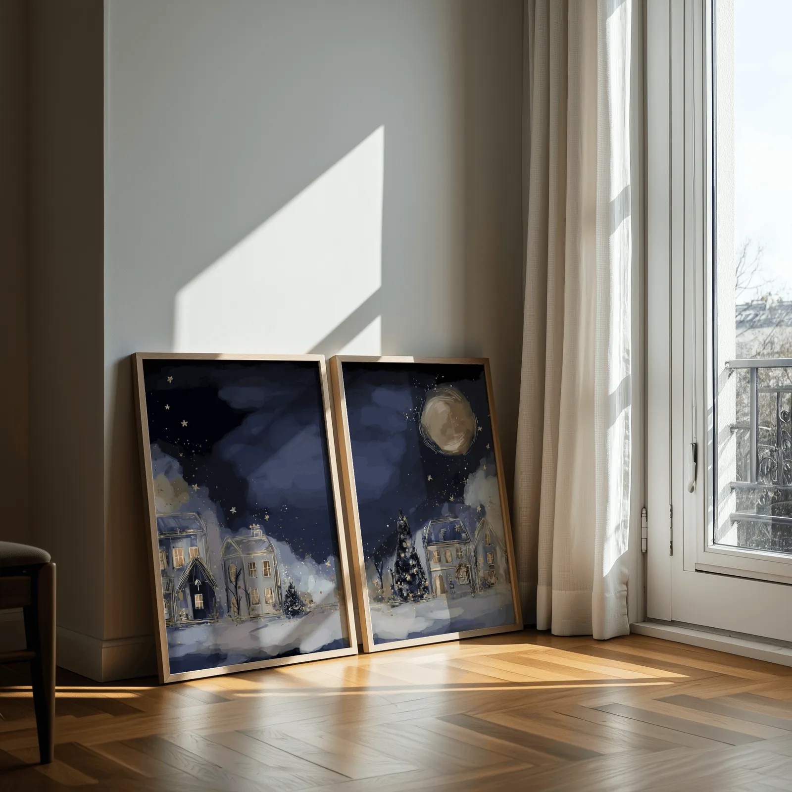 blue night village landscape wall art set of two, leaning against a sunlit wall by a curtained balcony door