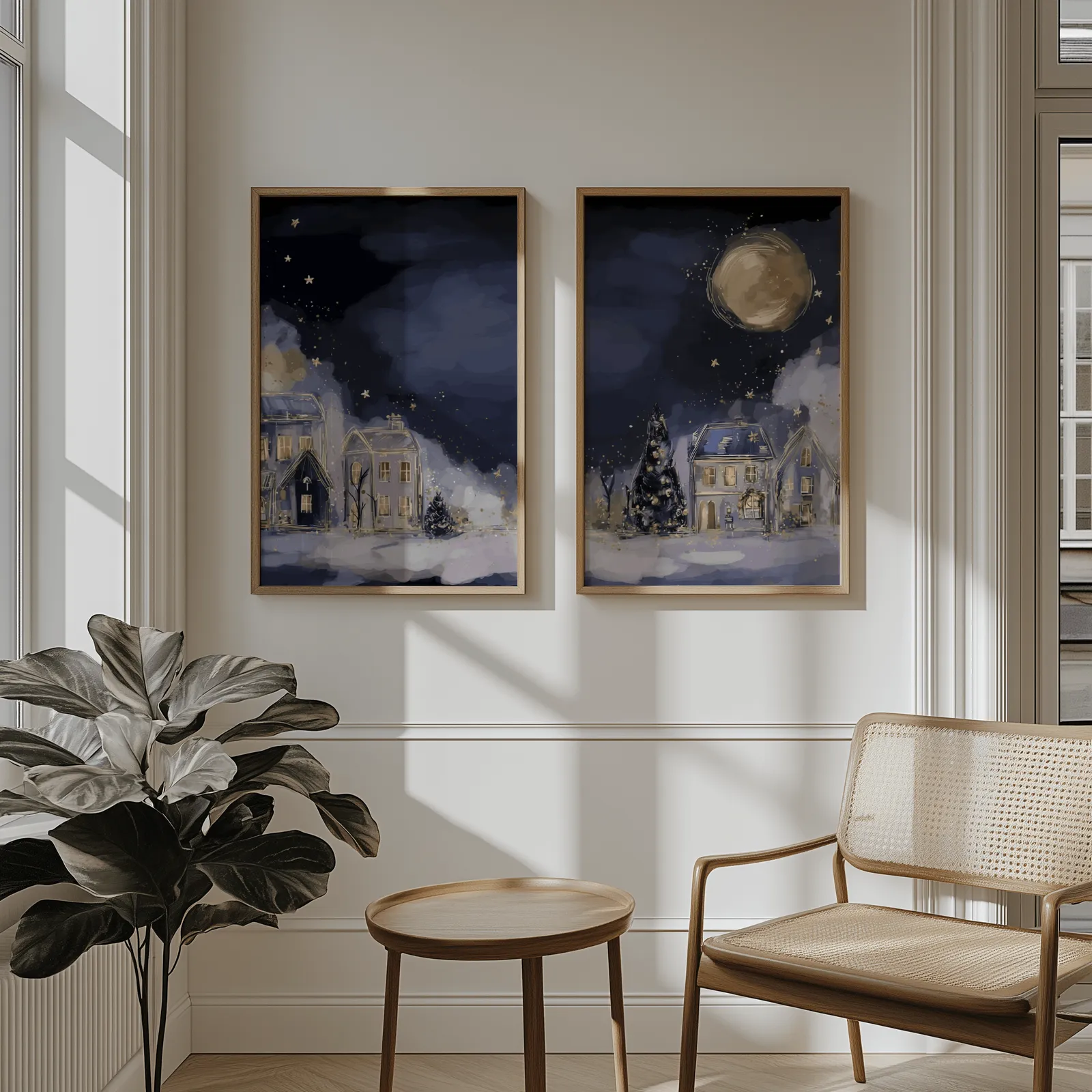 blue night village landscape wall art set of two, above wainscoting beside a cane armchair and fiddle-leaf fig