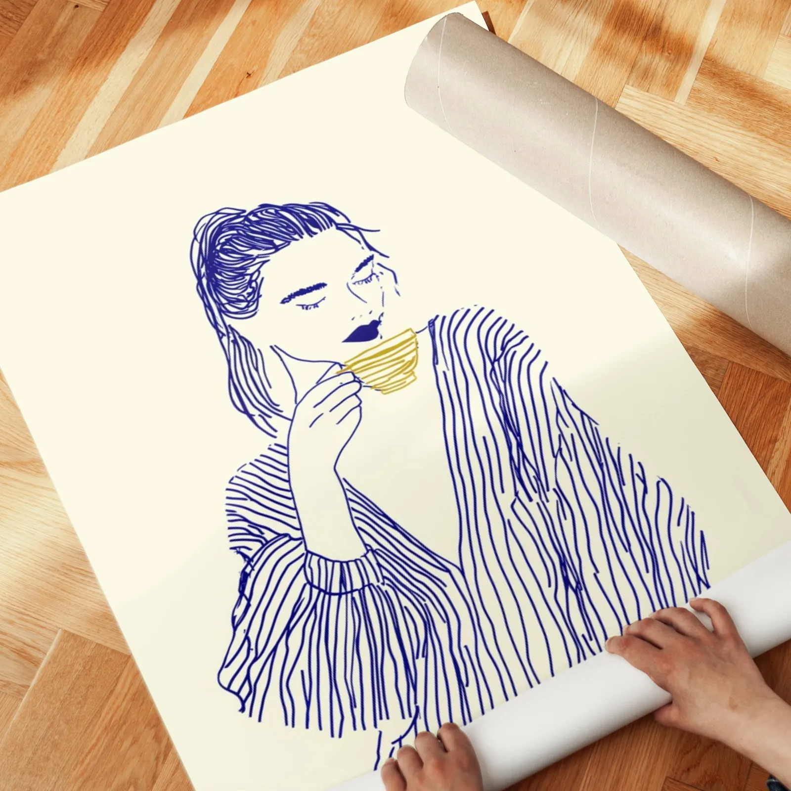 blue line art woman drinking coffee minimalist print, unrolled across a herringbone parquet floor by hand