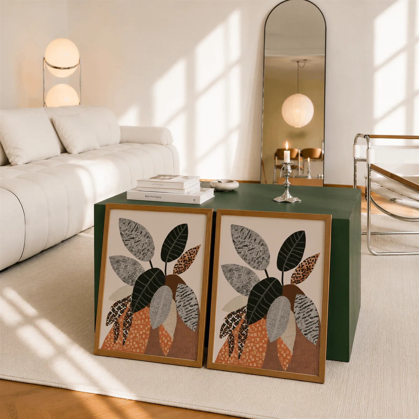 terracotta botanical wall art set of 2 patterned leaves, leaning against a dark green cube table beside an arched mirror