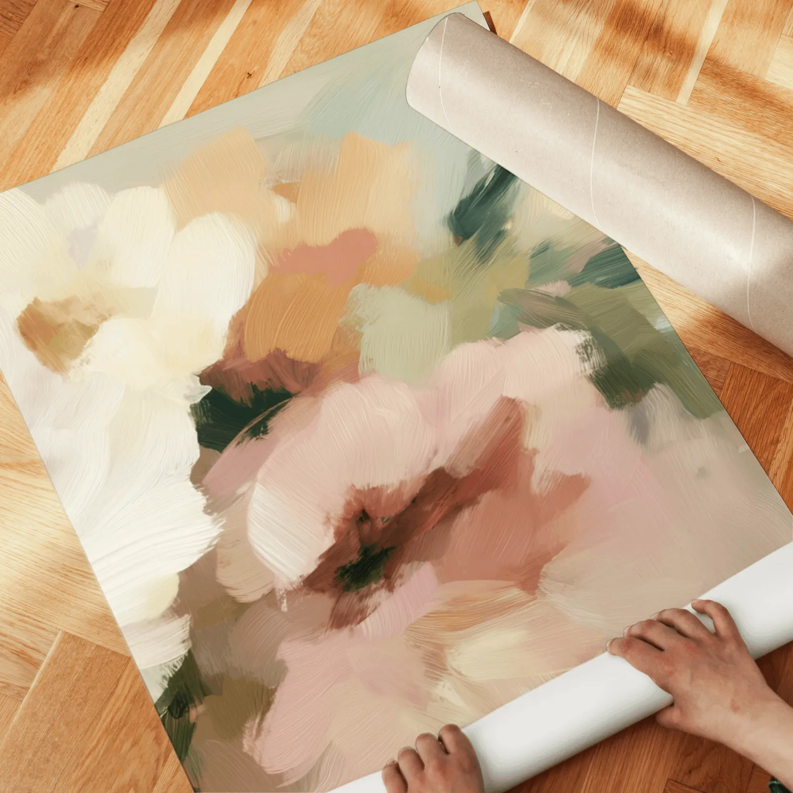 pink and cream floral wall art set of two, unrolled across a herringbone parquet floor by hand