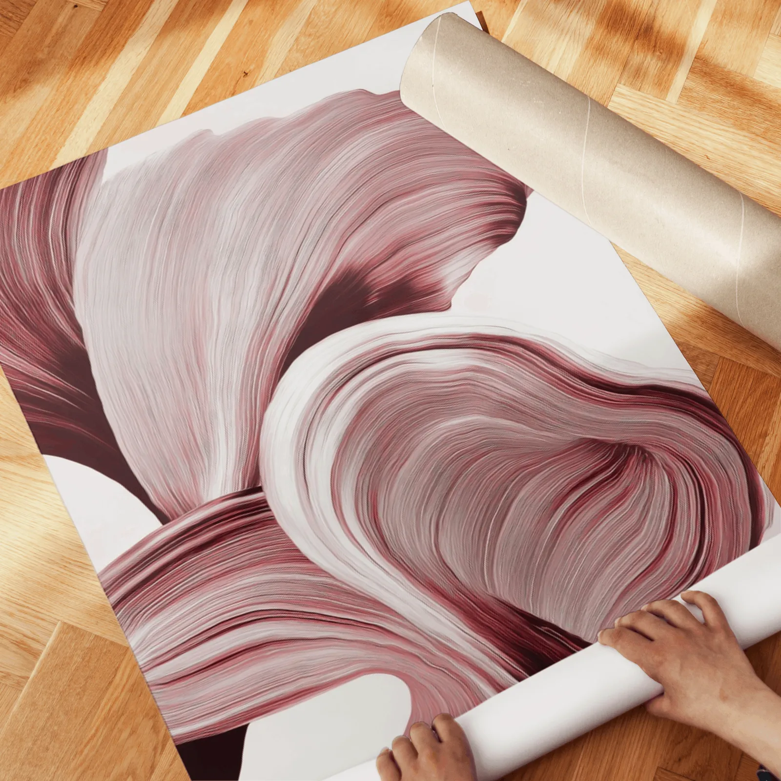 burgundy abstract floral wall art set of two, unrolled across a herringbone parquet floor by hand