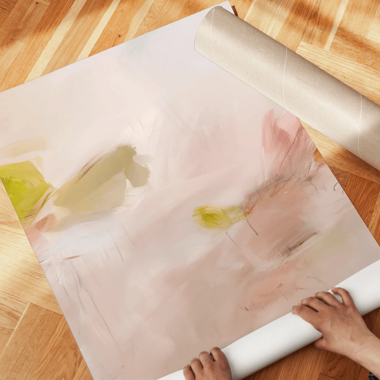 pink abstract wall art set of 3 in blush and olive, unrolled across a herringbone wood floor by hand