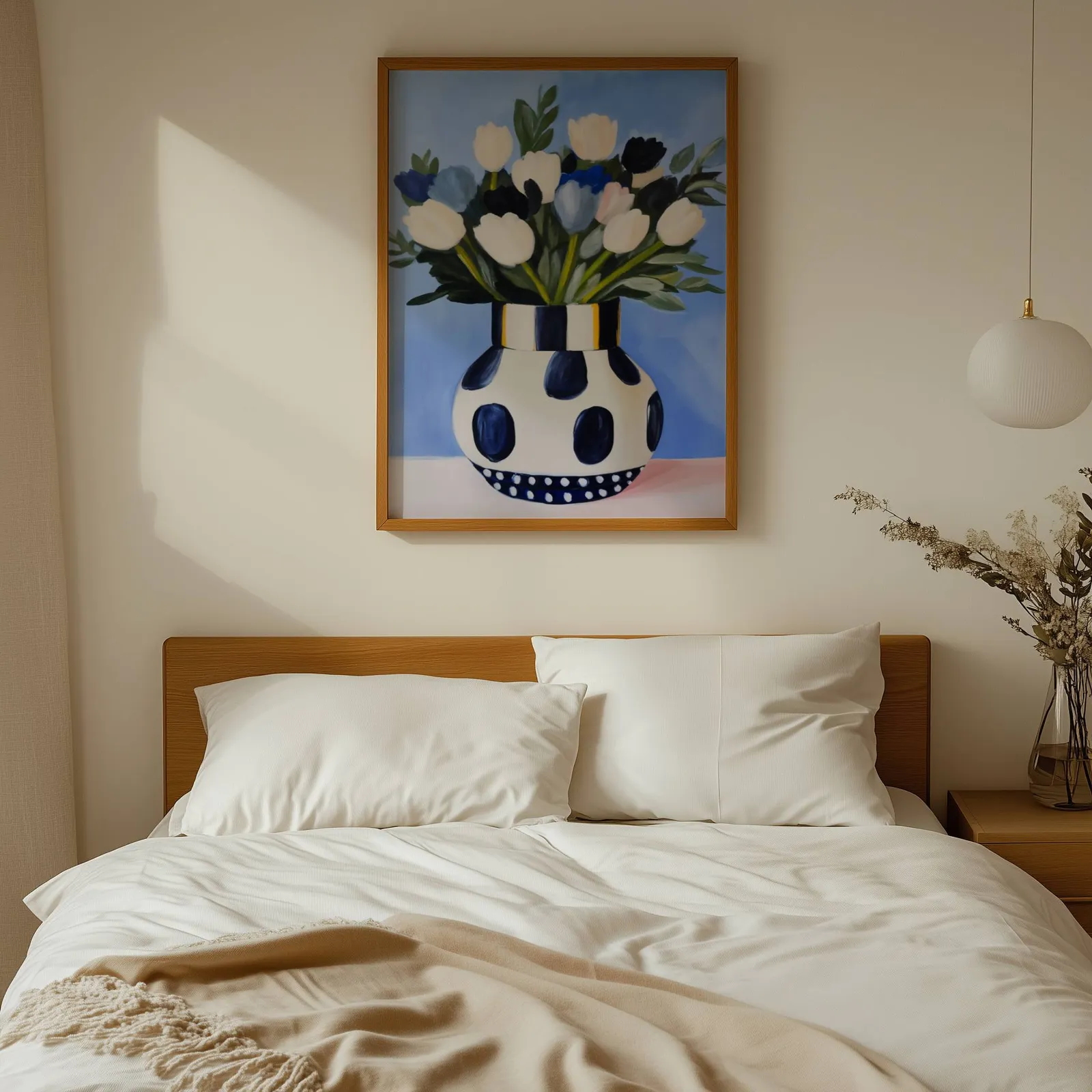 blue floral wall art with polka dot vase, above a wooden headboard with white linen pillows