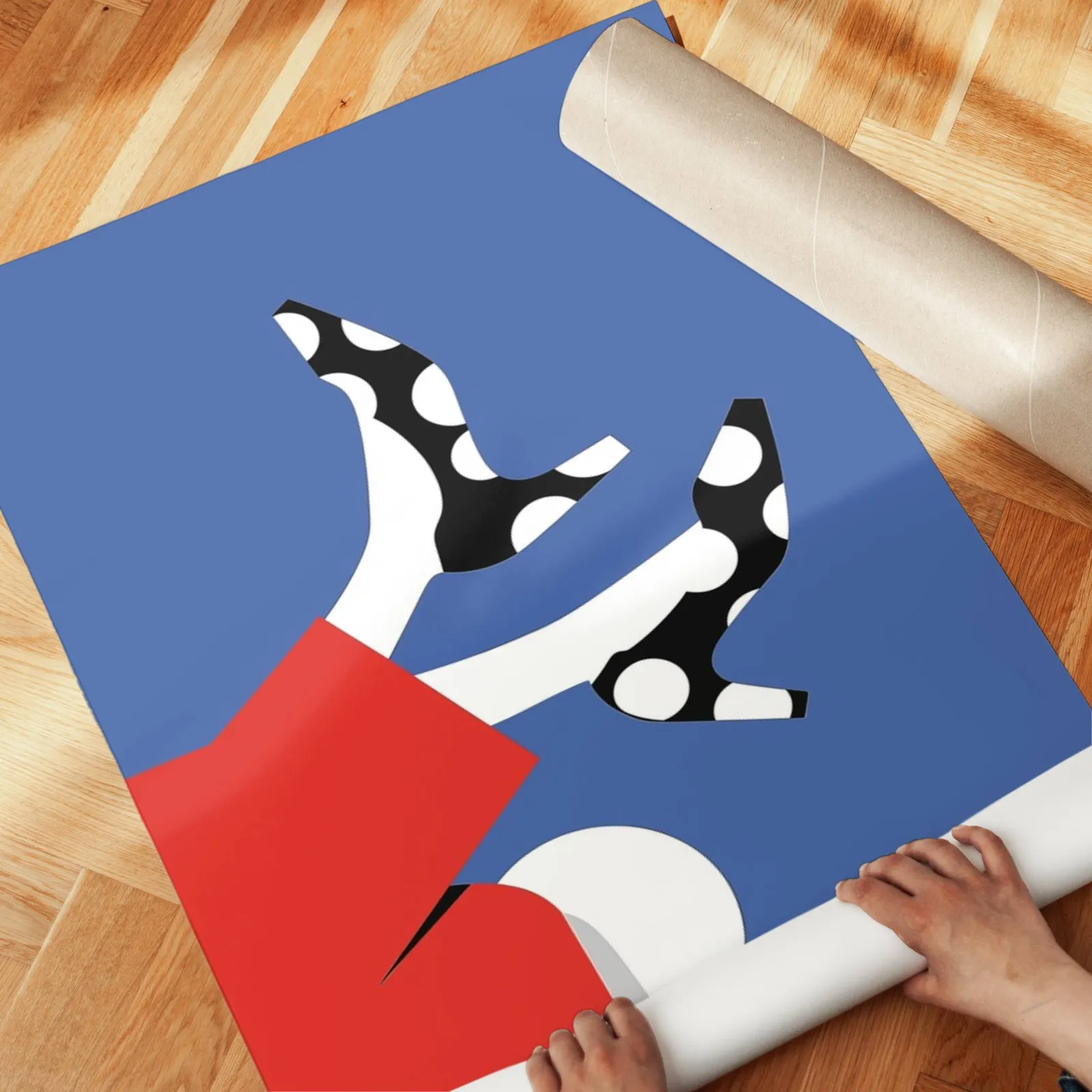 playful abstract woman wall art in red and blue, unrolled across a herringbone parquet floor by hand
