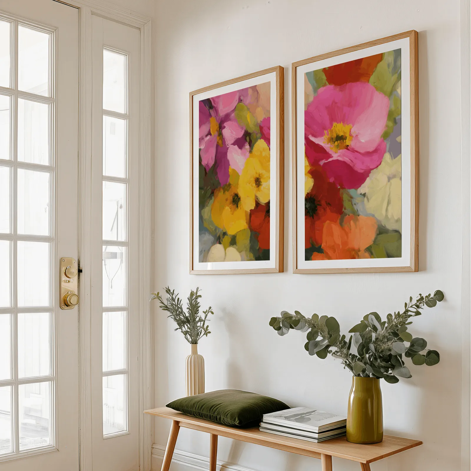 colorful floral wall art set of two, above a wooden bench with eucalyptus stems and a green cushion