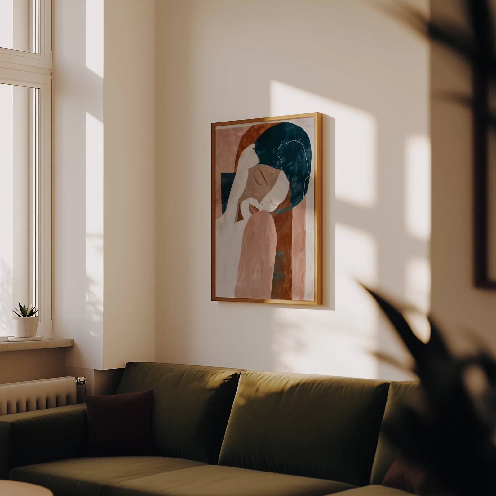 terracotta abstract woman wall art, above an olive velvet sofa in raking afternoon light