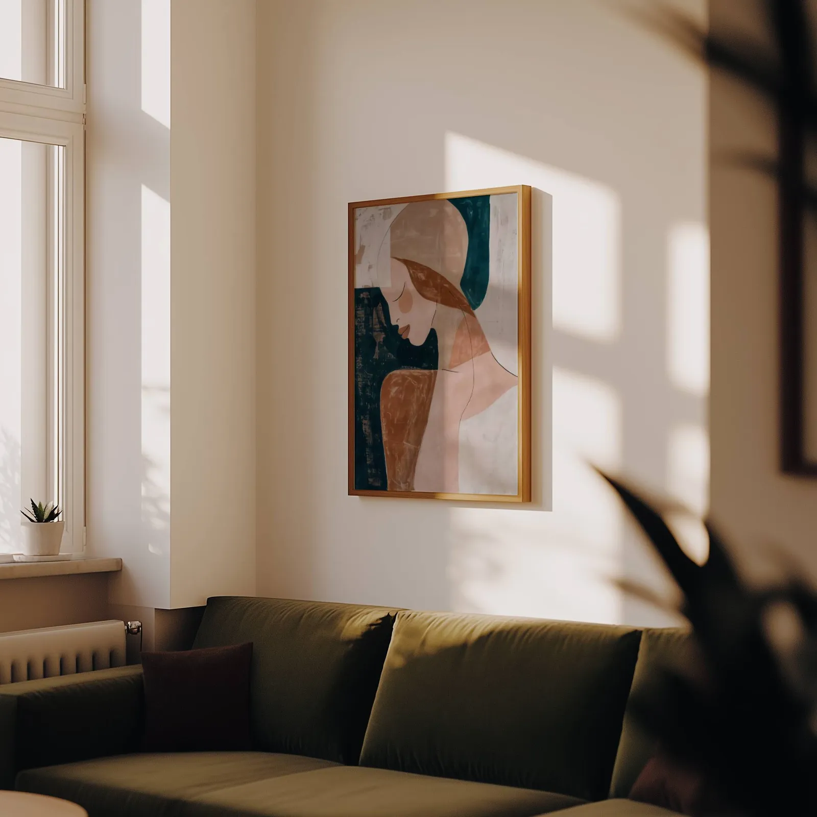 abstract terracotta woman portrait wall art, above an olive velvet sofa in raking afternoon light
