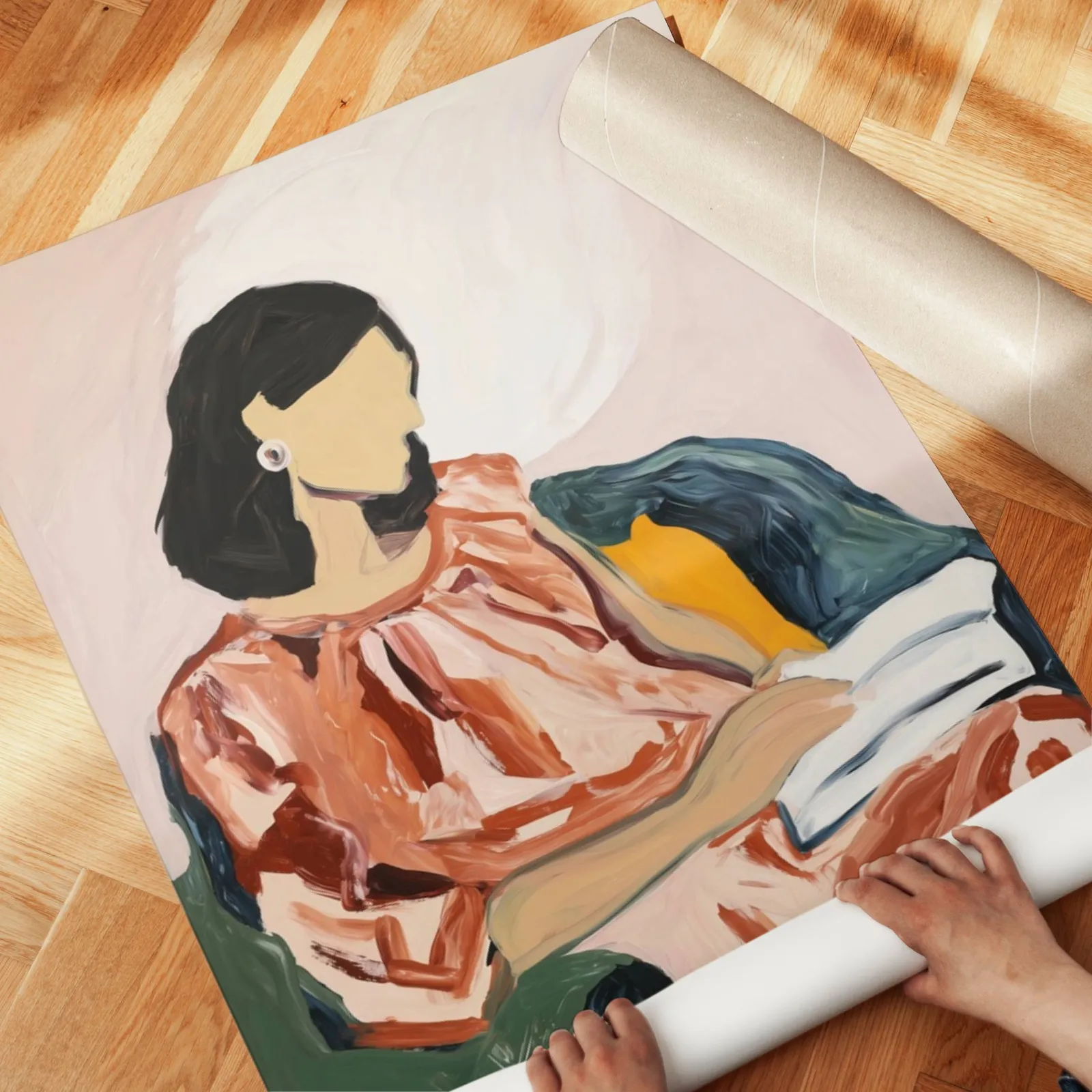 abstract woman reading portrait wall art, unrolled across a herringbone parquet floor by hand