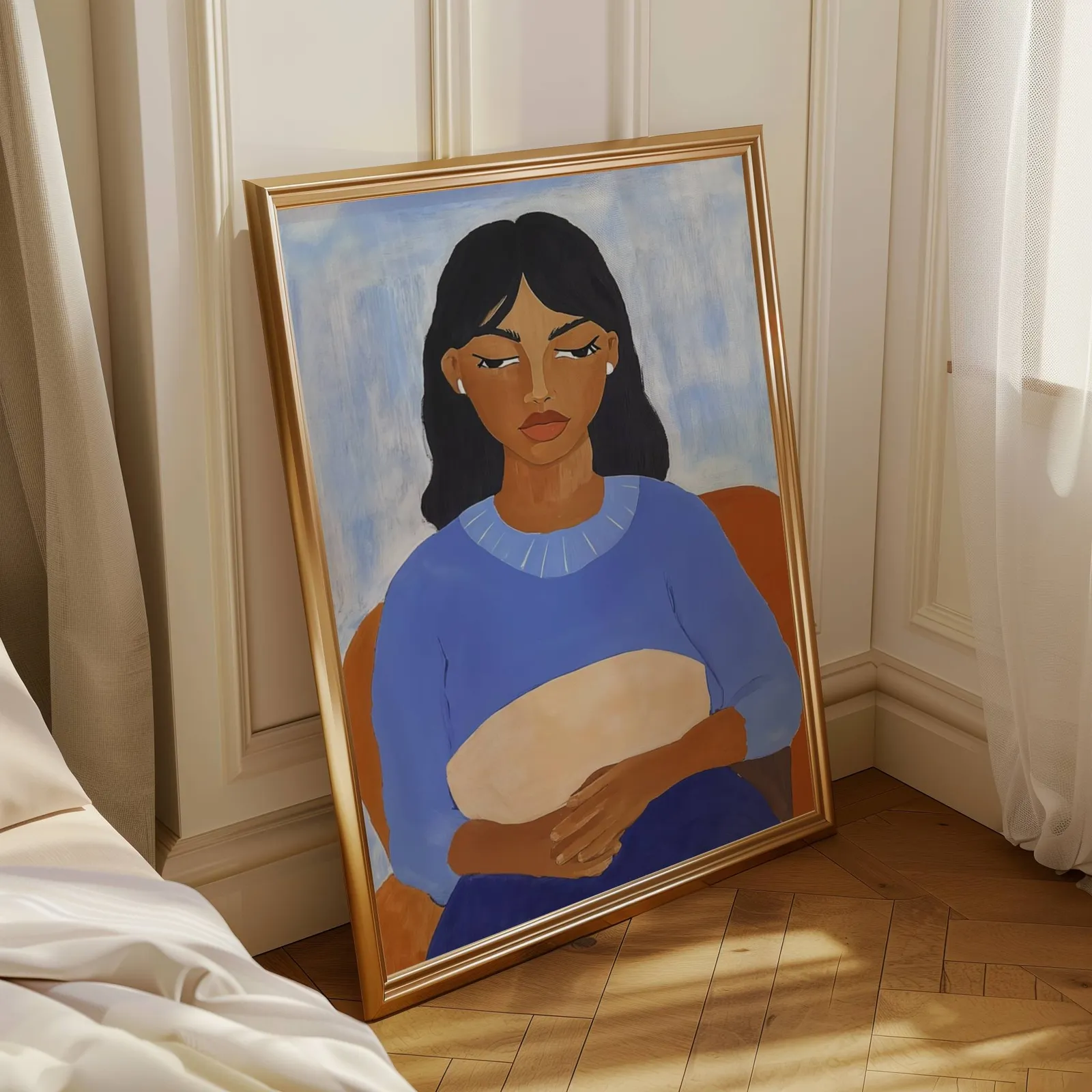 blue portrait wall art of seated woman, leaning in a sunlit corner beside sheer curtains and herringbone floor