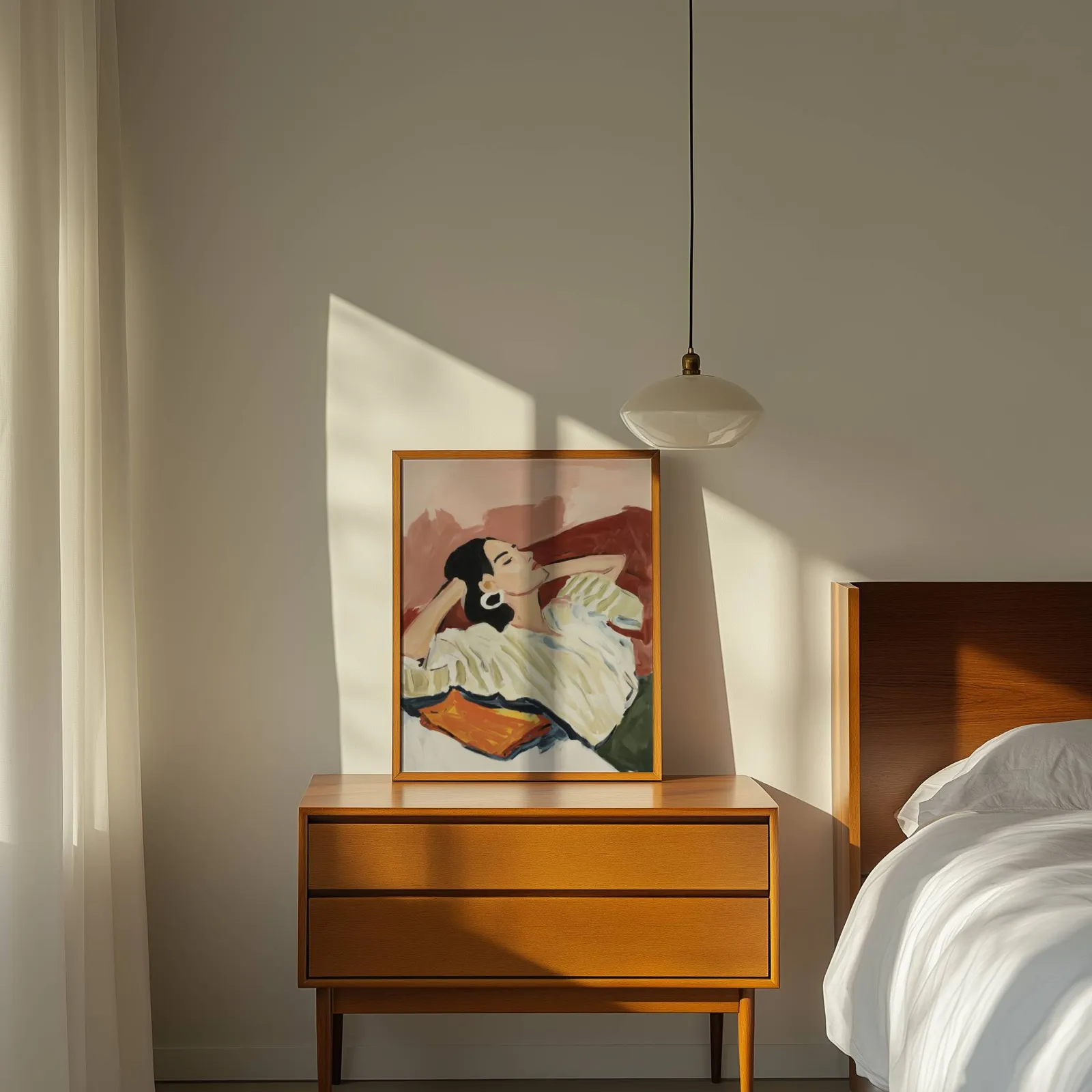 terracotta reclining woman portrait wall art, propped on a wooden dresser beside a pendant lamp