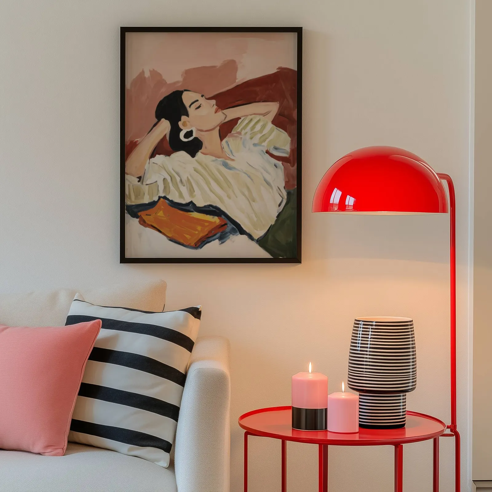 terracotta reclining woman portrait wall art, above a cream sofa beside a glossy red dome lamp