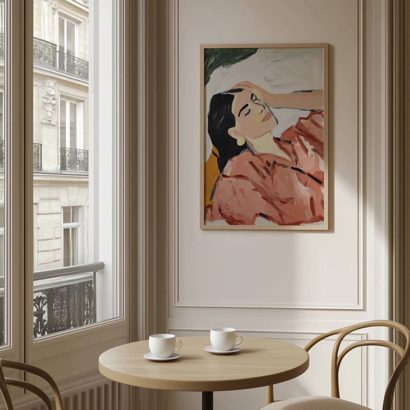 terracotta abstract woman wall art, above a round café table set with two coffee cups