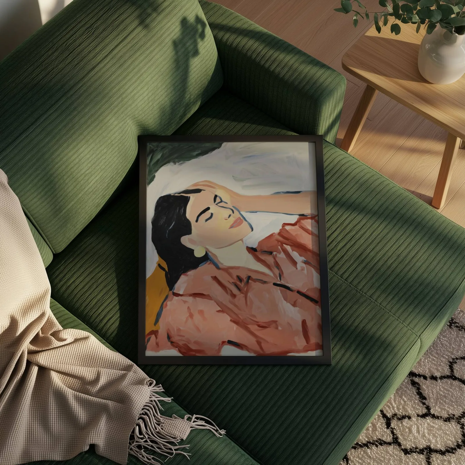 terracotta abstract woman wall art, propped on a ribbed olive-green sofa beside a fringed throw