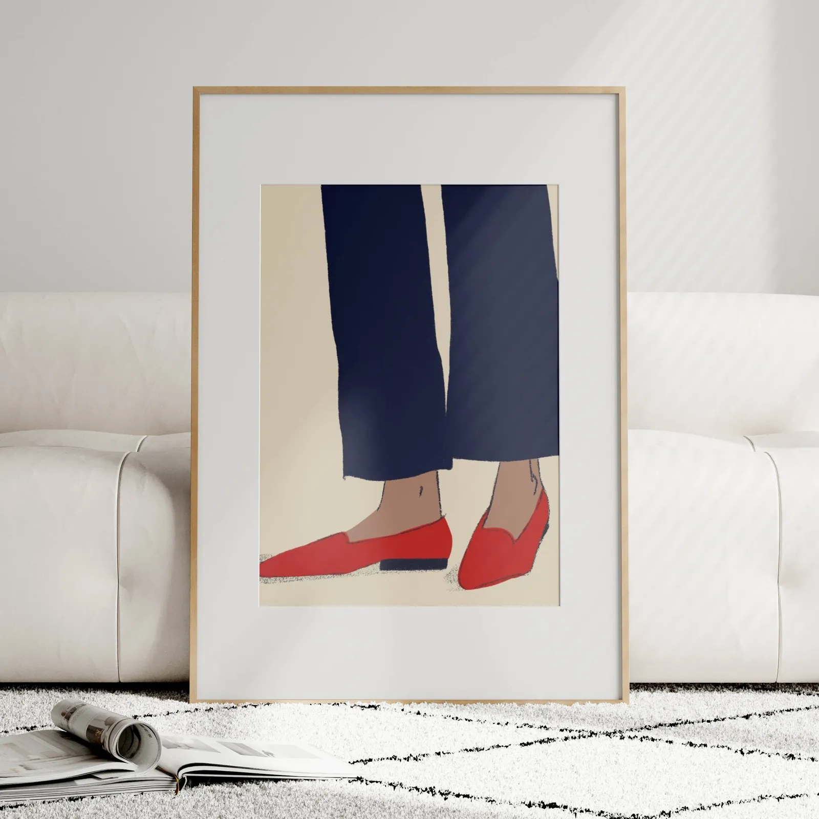 red loafers navy trousers fashion wall art, leaning against a plush cream sofa on a patterned rug