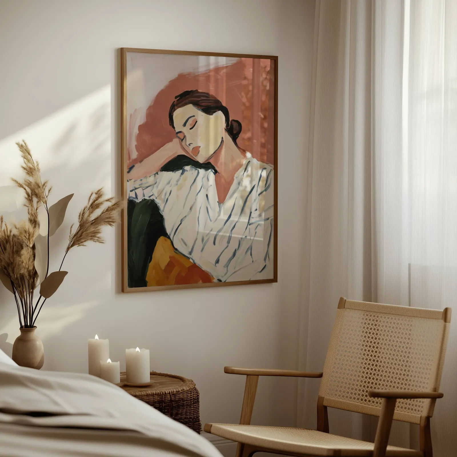 terracotta abstract portrait wall art of resting woman, above a woven side table with lit candles and pampas grass