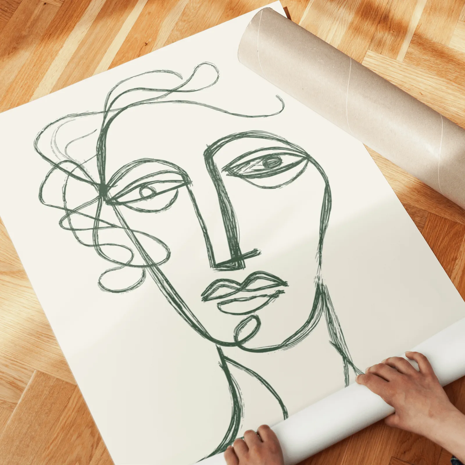 green and cream abstract face line art set of two, unrolled across a herringbone parquet floor by hand