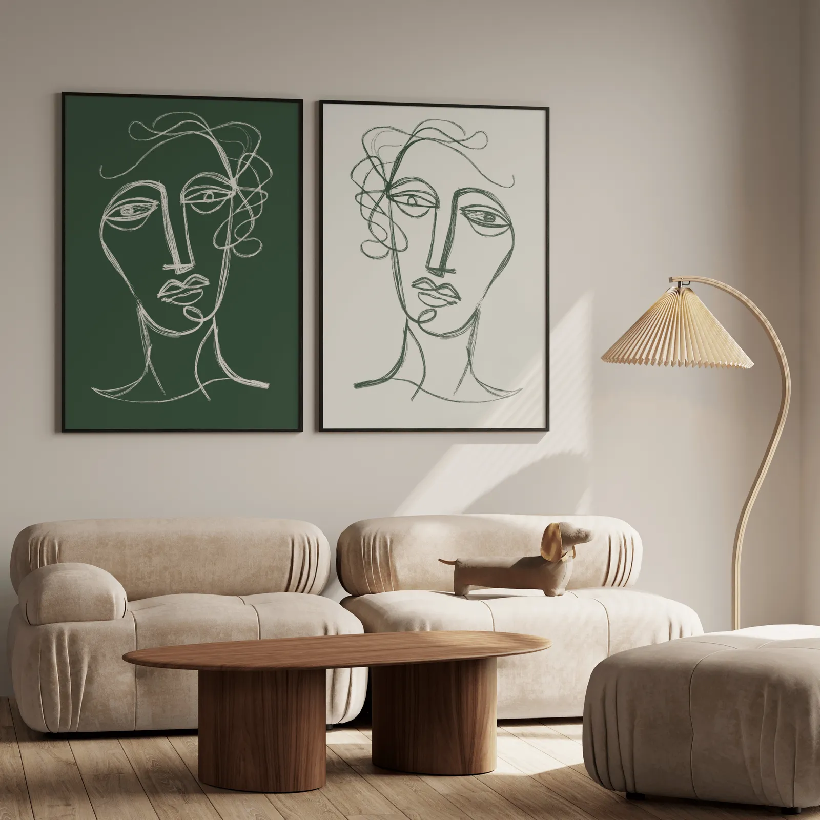 green and cream abstract face line art set of two, above a plush beige sofa with a pleated lamp nearby