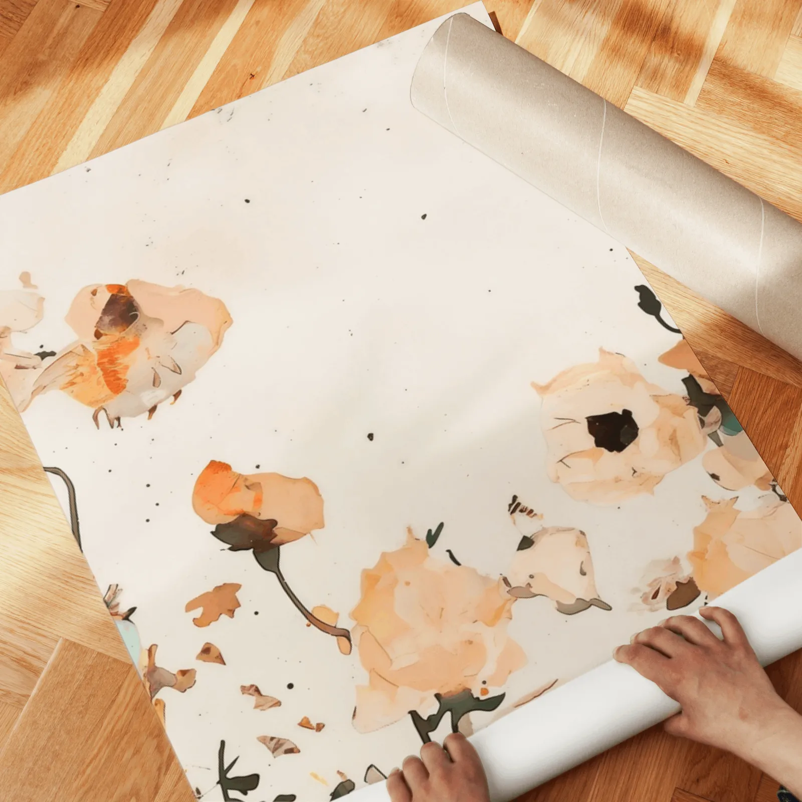 orange abstract floral wall art set of two, unrolled across a herringbone parquet floor by hand