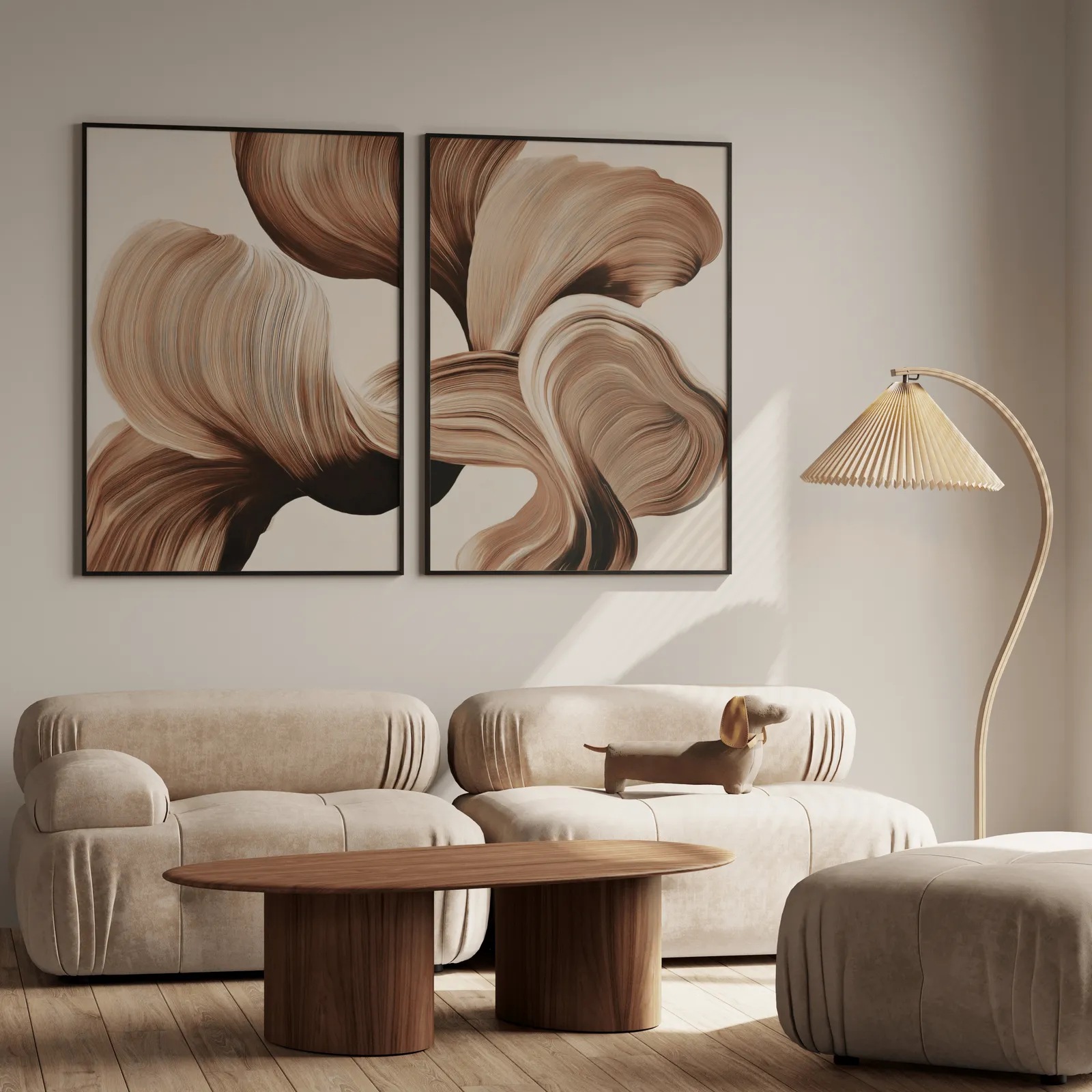 beige abstract wall art set of 2 with brown flowing curves, above a plush beige sofa with a pleated lamp nearby