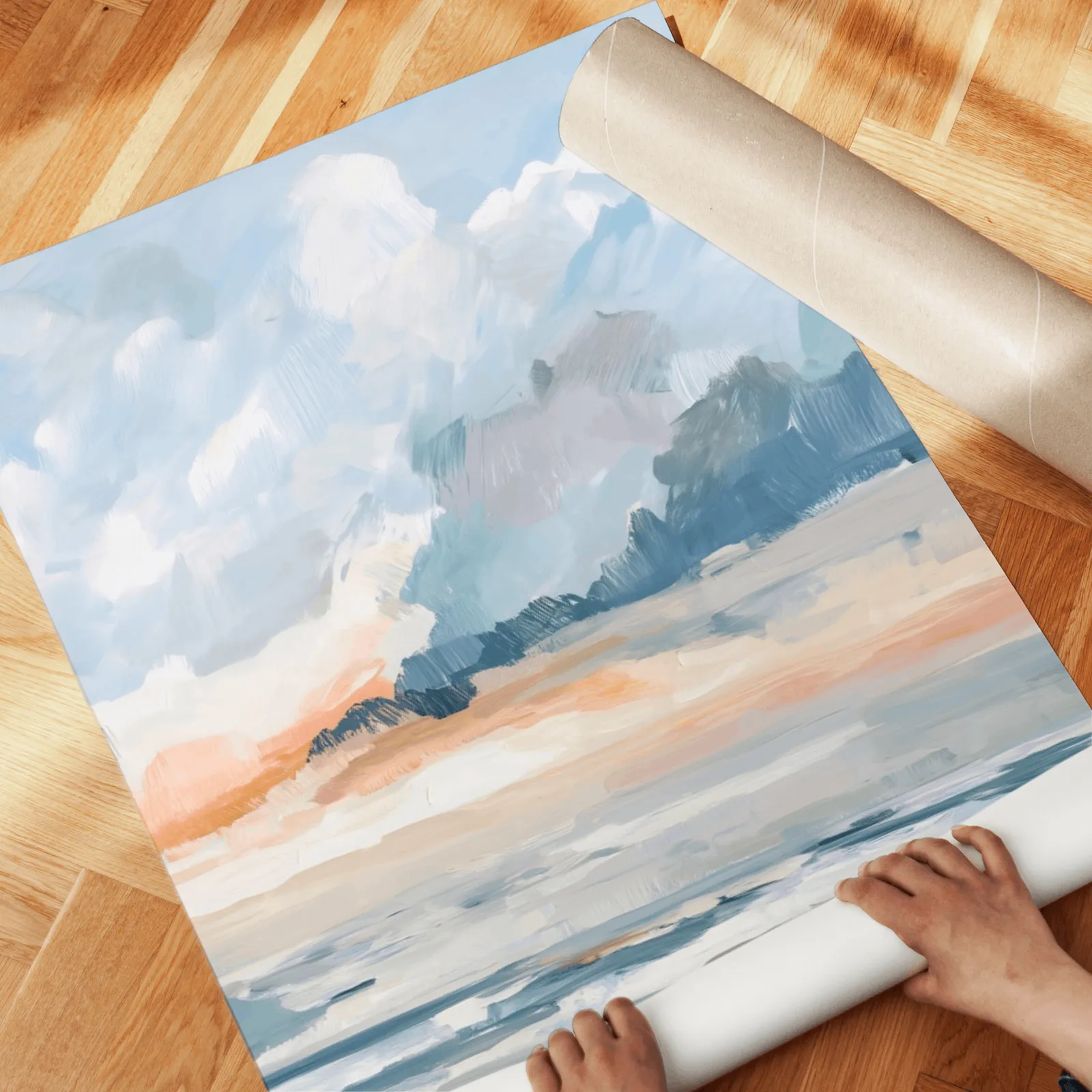 blue and orange coastal sky wall art set of two, unrolled across a herringbone parquet floor by hand