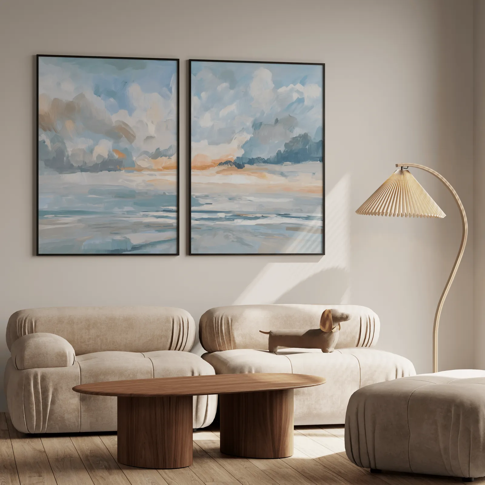 blue and orange coastal sky wall art set of two, above a plush beige sofa with a pleated lamp nearby