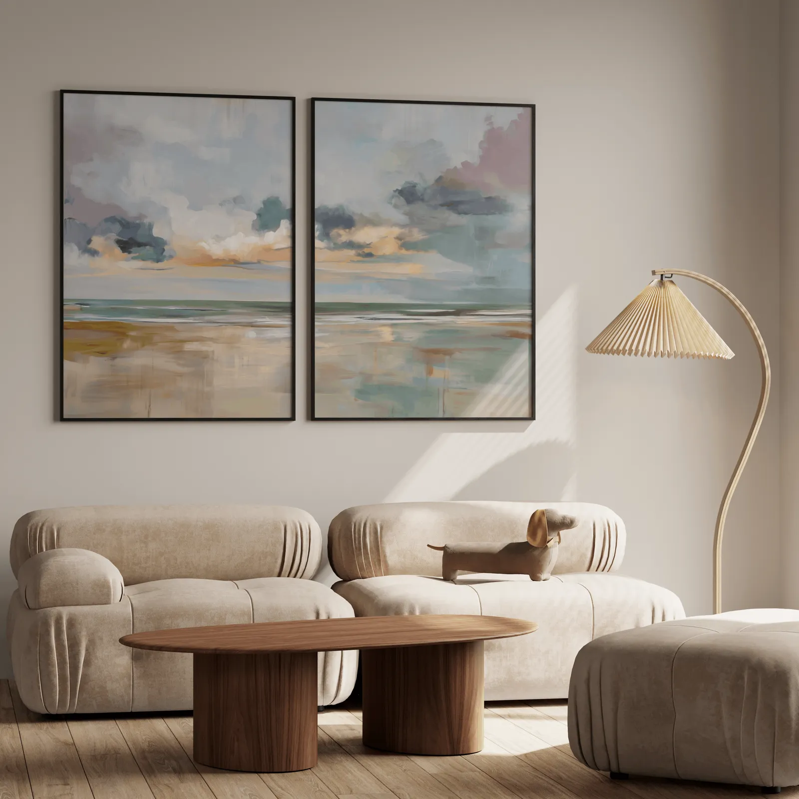 coastal sky wall art set of 2, above a plush beige sofa with a pleated lamp nearby