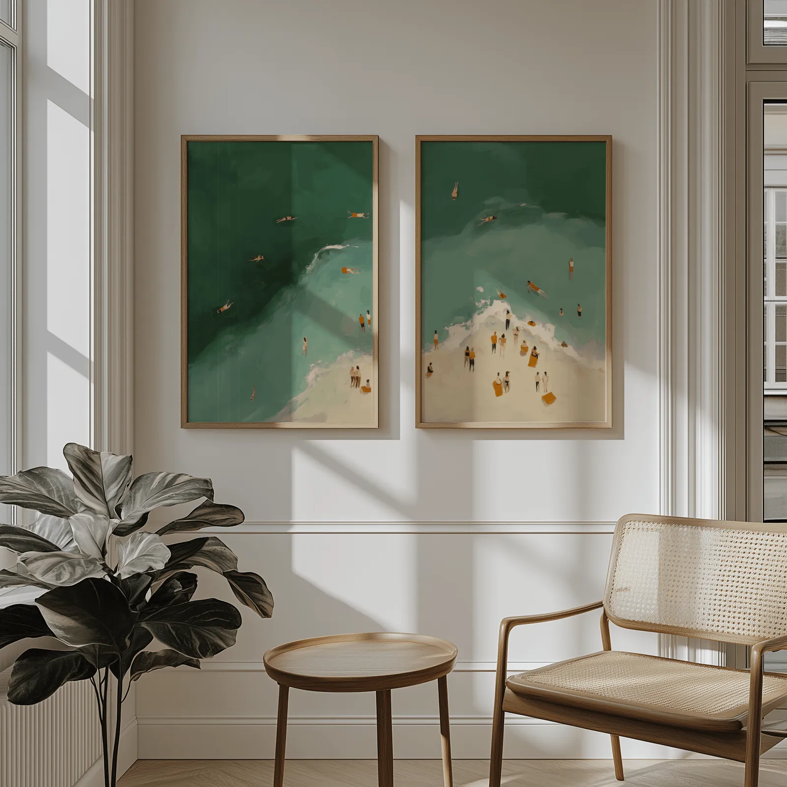 green coastal beach wall art set of two with swimmers, above wainscoting beside a cane armchair and fiddle-leaf fig