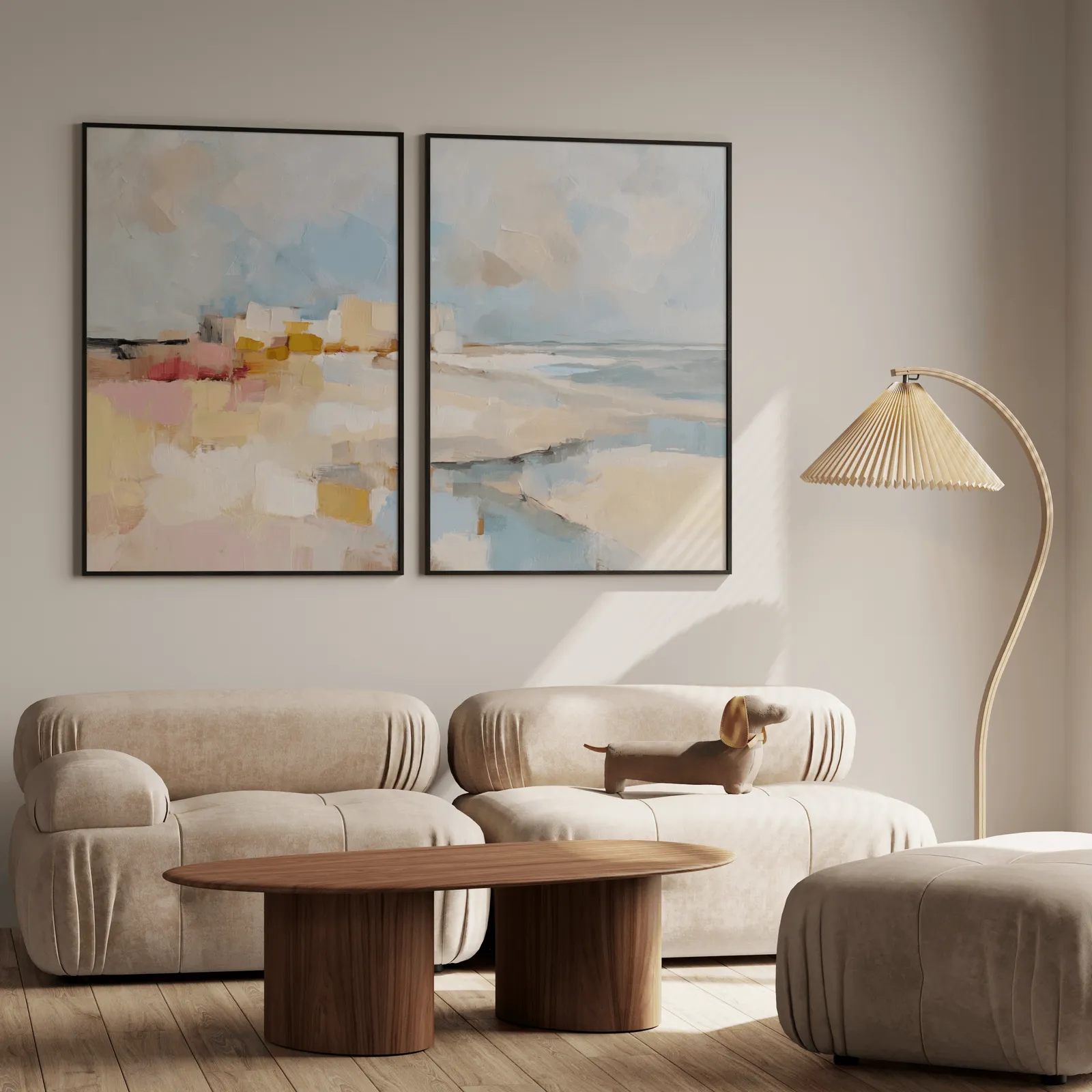 pink and blue coastal abstract wall art set of two, above a plush beige sofa with a pleated lamp nearby