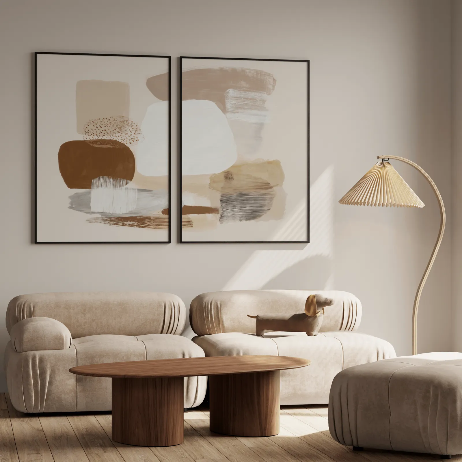 beige abstract minimalist wall art set of 2, above a plush beige sofa with a pleated lamp nearby