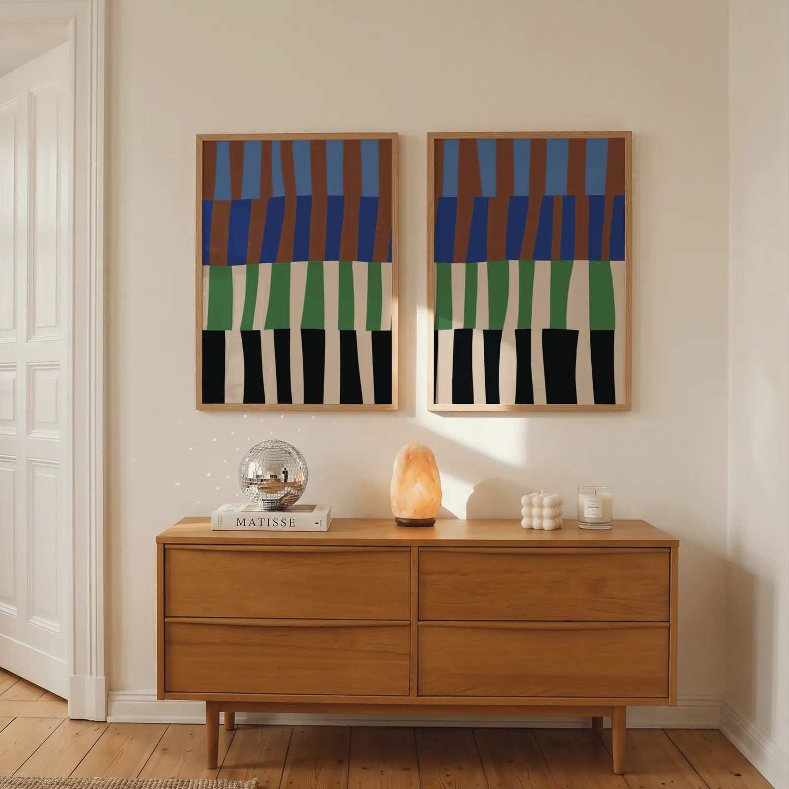 blue green abstract landscape wall art set of 2, above a wooden dresser with a salt lamp and disco ball
