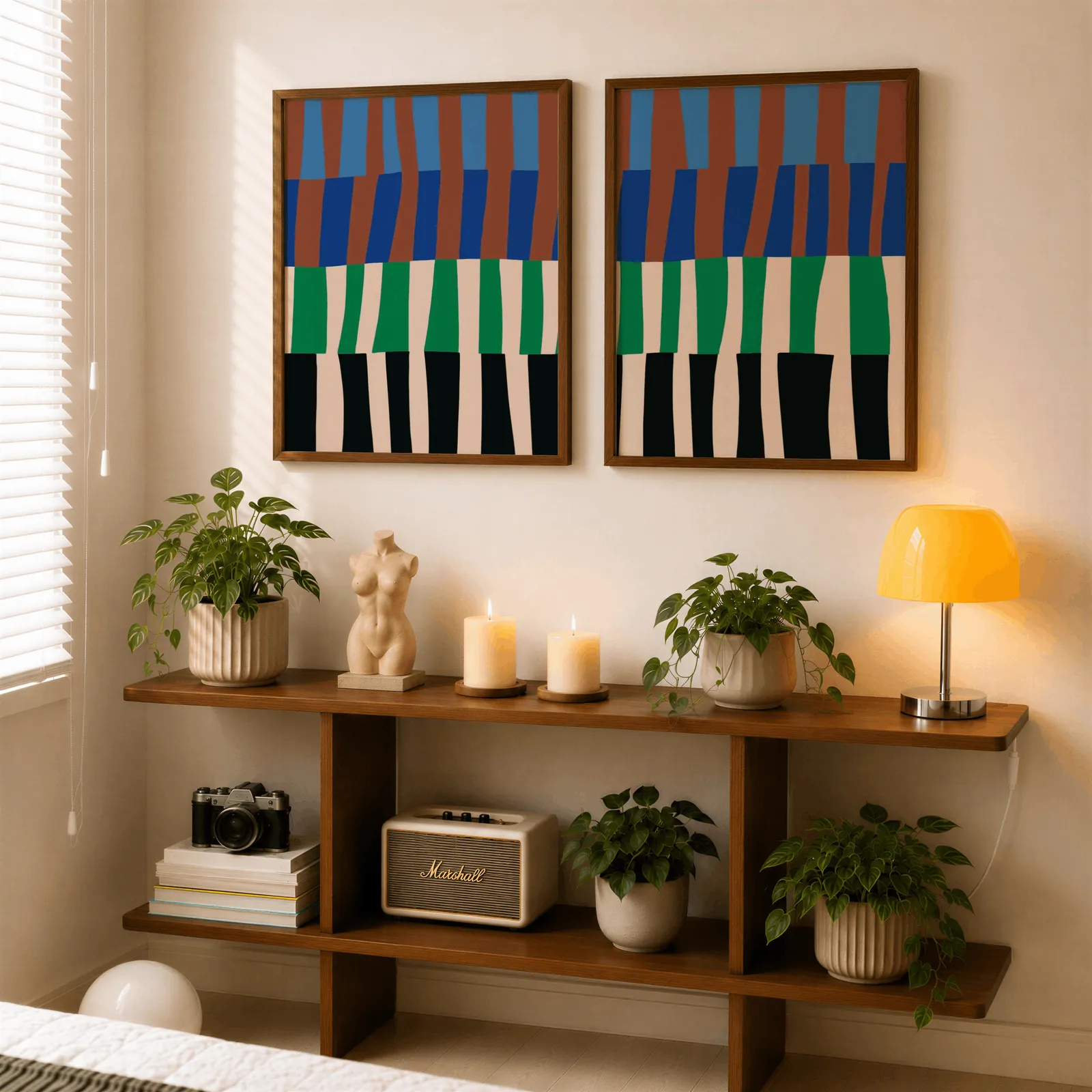 blue green abstract landscape wall art set of 2, above a wooden console shelf with potted plants and a yellow lamp