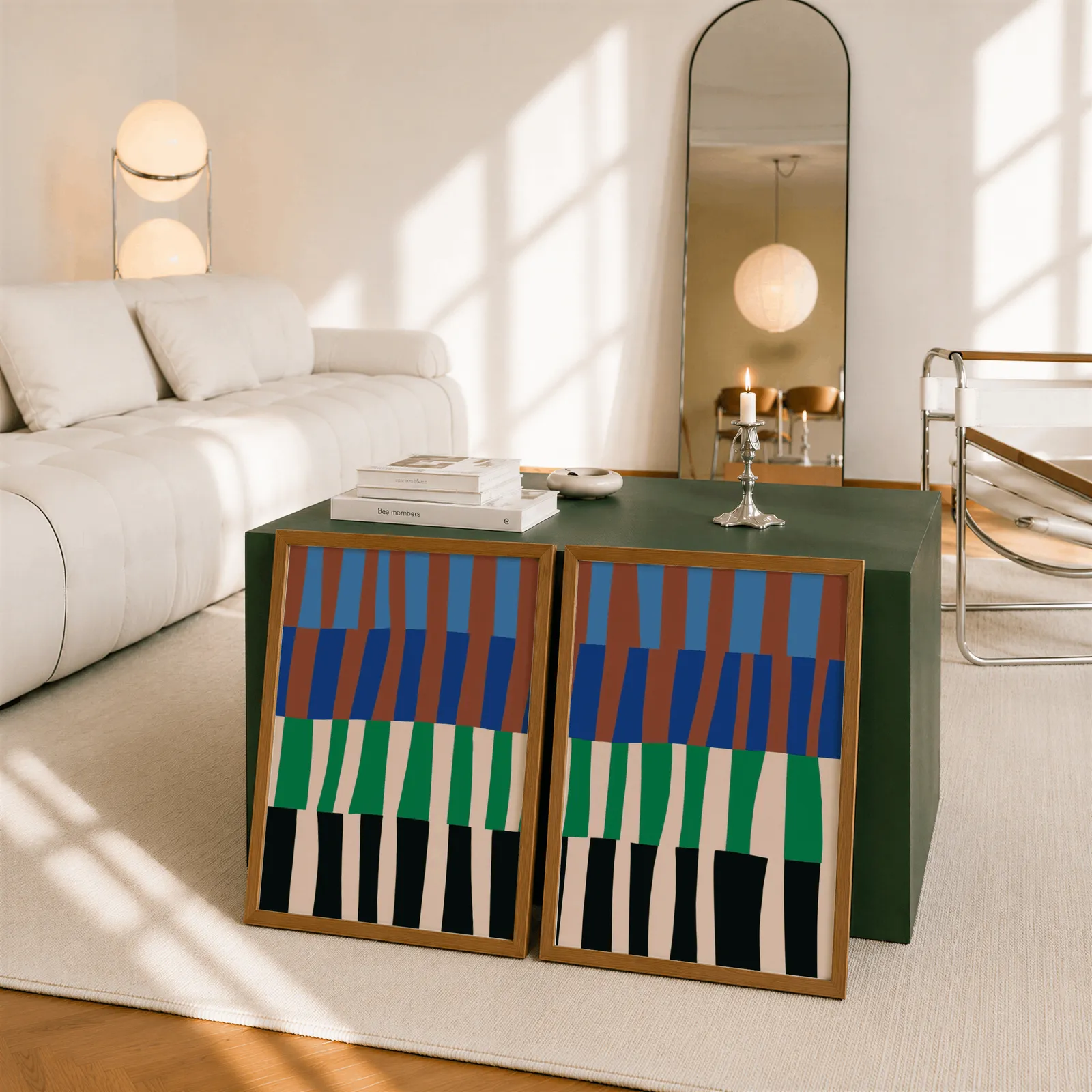 blue green abstract landscape wall art set of 2, leaning against a dark green cube table beside an arched mirror