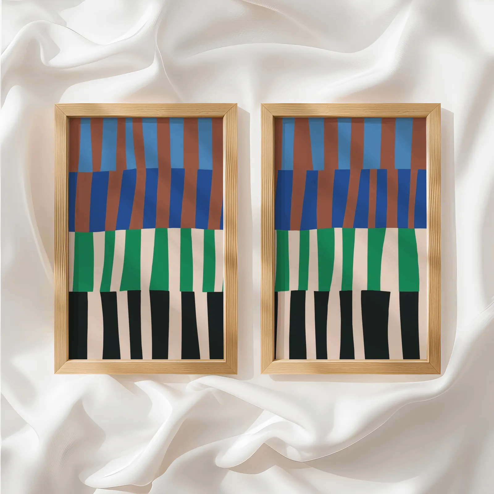 blue green abstract landscape wall art set of 2, side by side atop rumpled white silky fabric