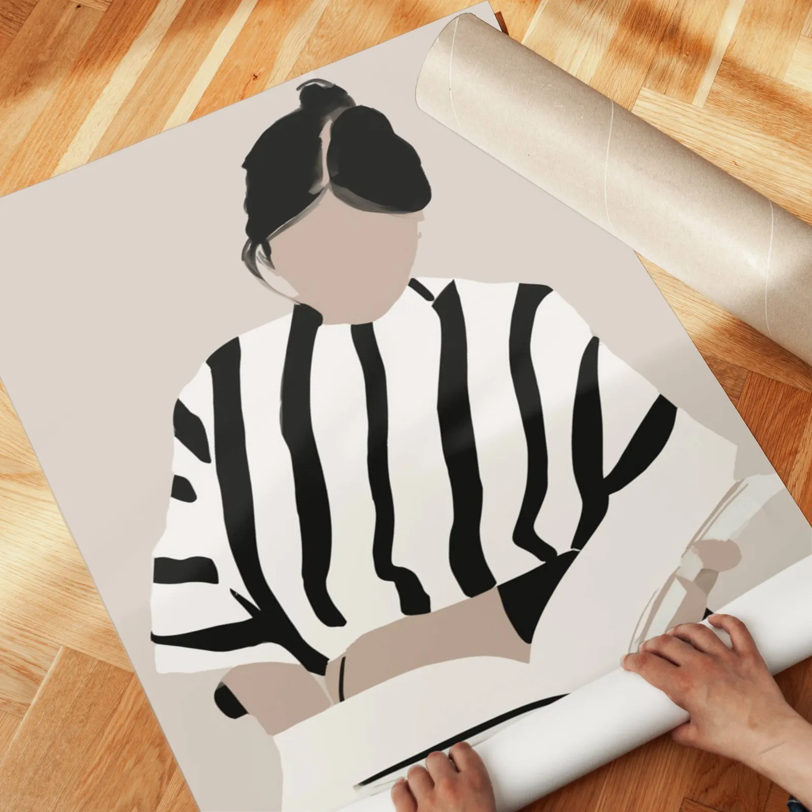 woman reading minimalist wall art, unrolled across a herringbone parquet floor by hand