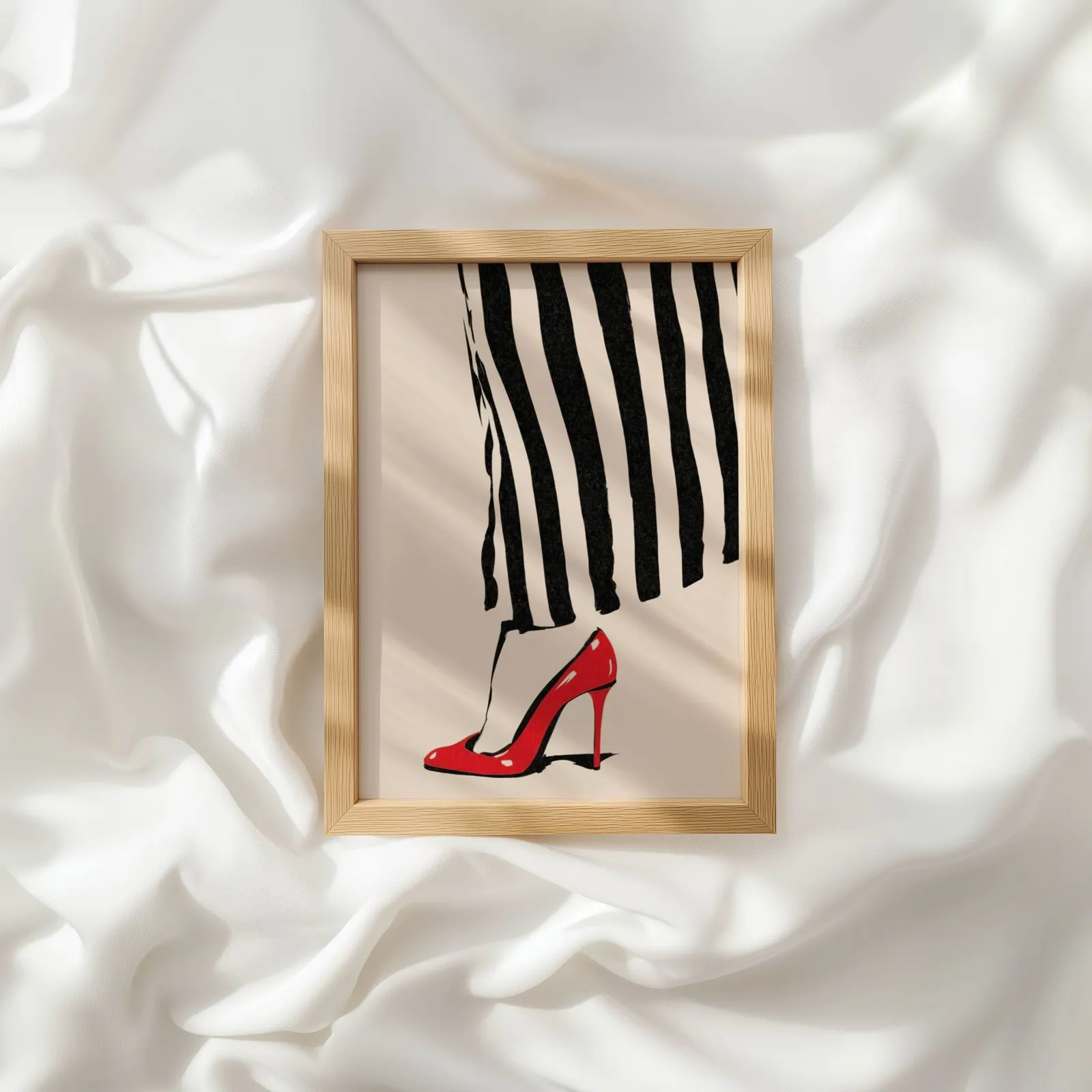 red high heel striped fashion wall art, resting atop rumpled white silky fabric