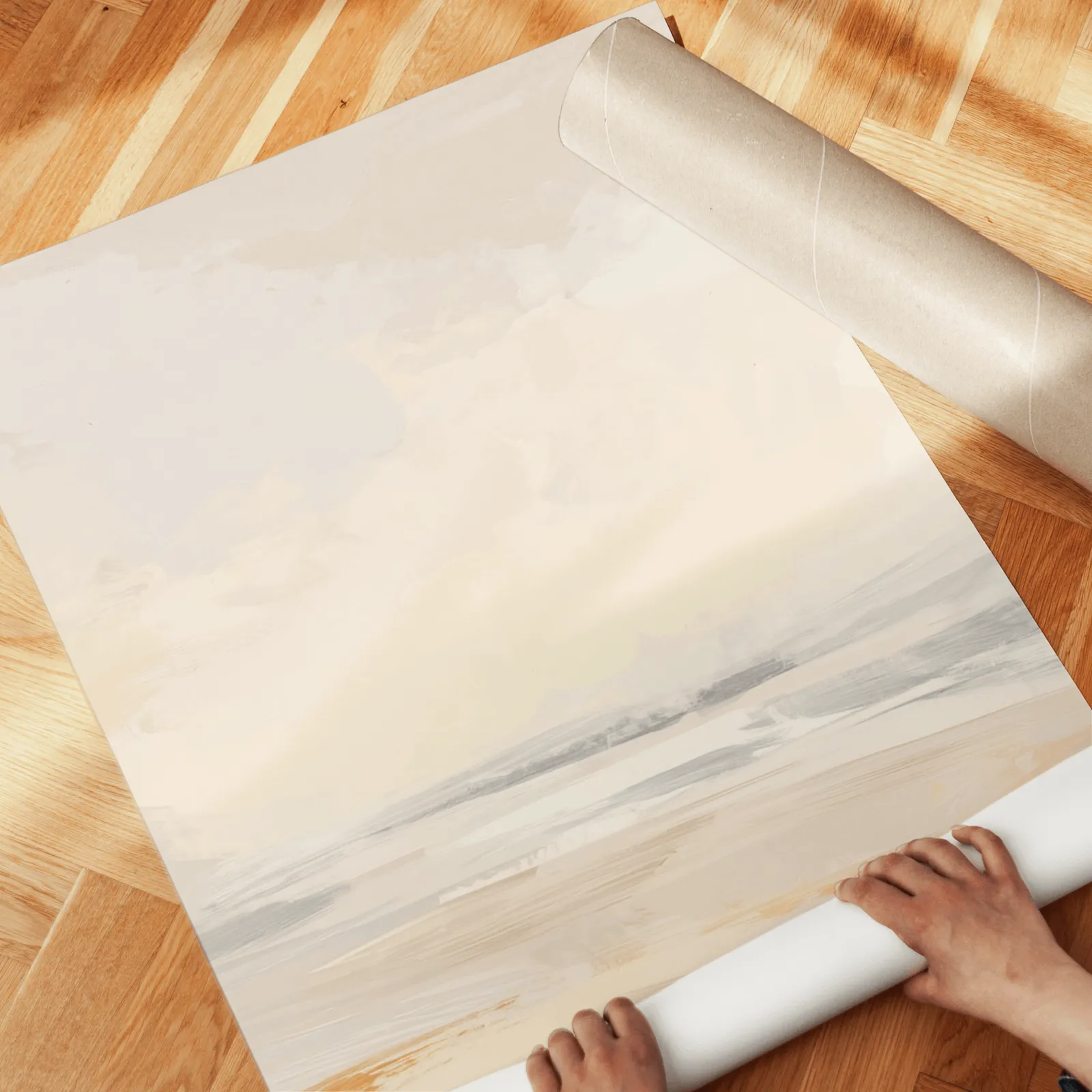 beige abstract landscape wall art set of three, unrolled across a herringbone wood floor by hand
