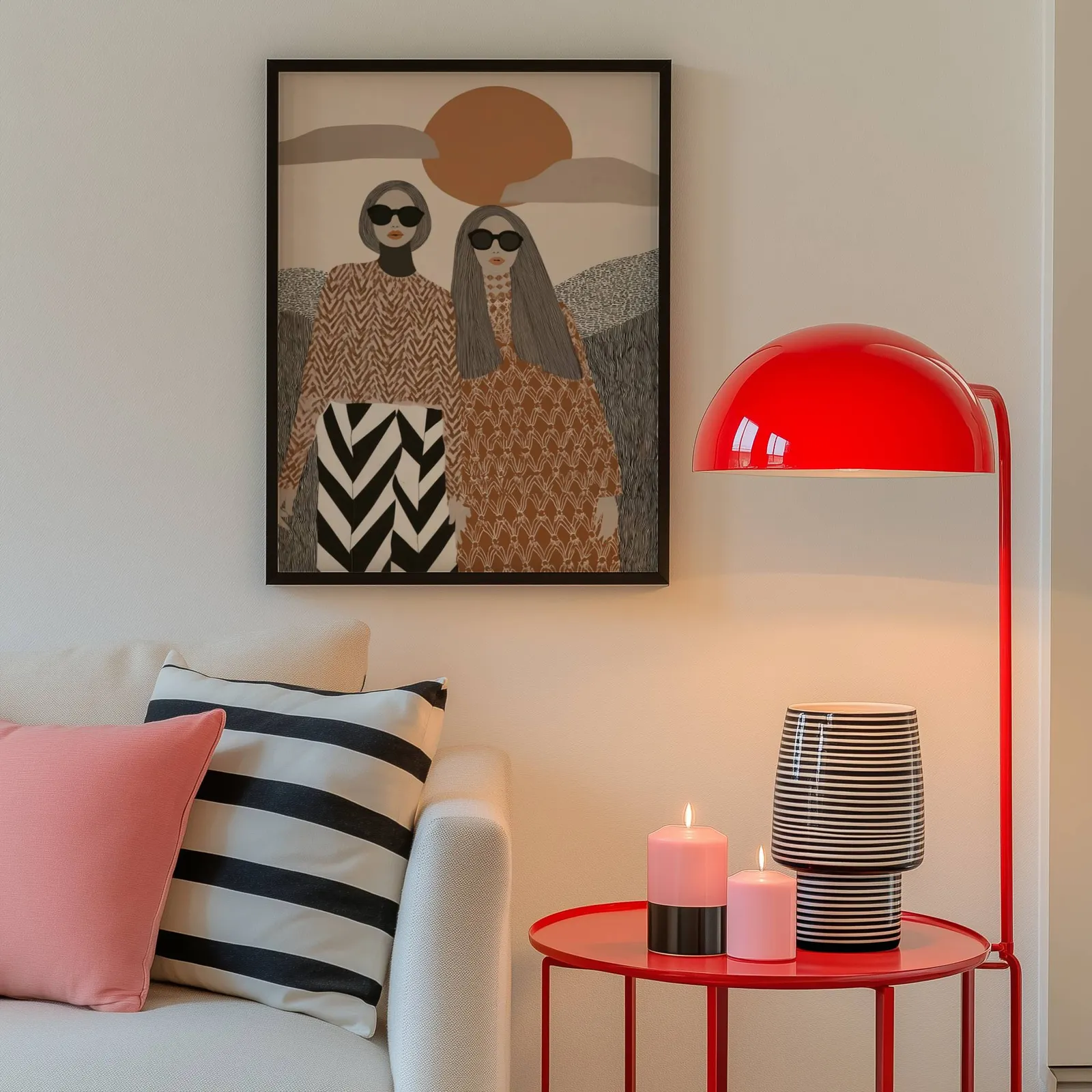 terracotta boho portrait wall art of two women, above a cream sofa beside a glossy red dome lamp