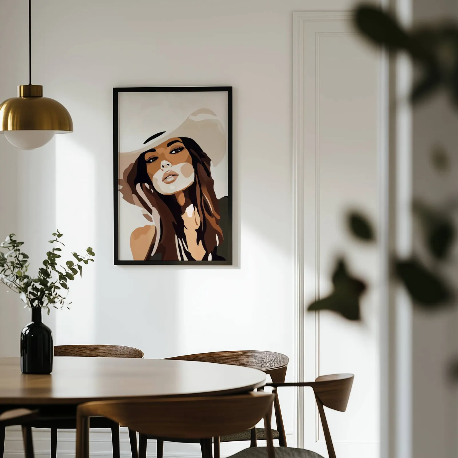 brown abstract woman portrait wall art, on a white wall above a round wooden dining table