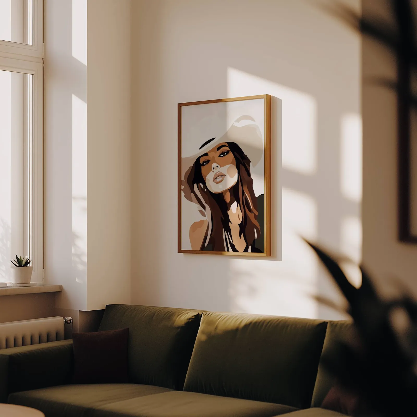 brown abstract woman portrait wall art, above an olive velvet sofa in raking afternoon light