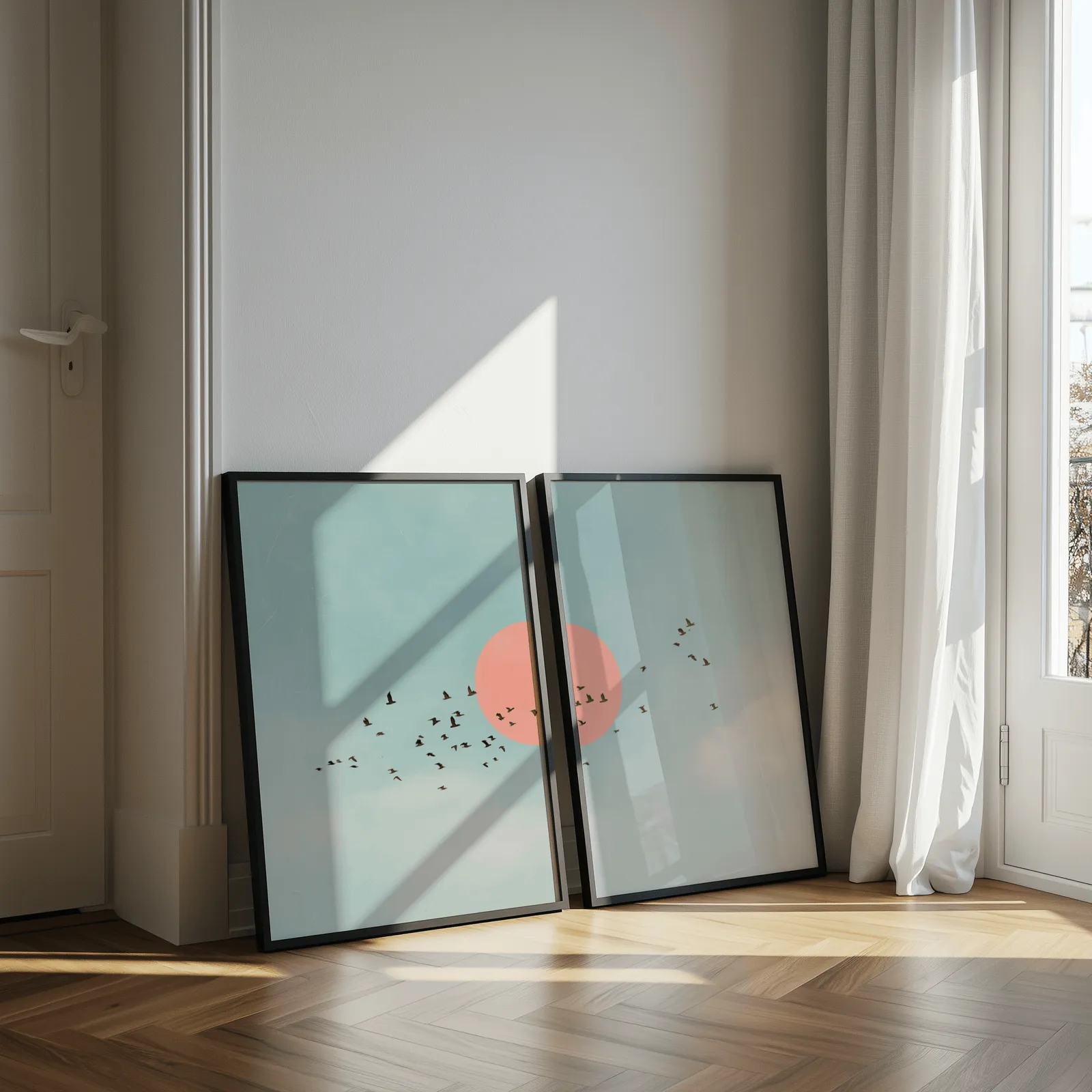 blue and pink bird wall art set of two, leaning against a sunlit wall by herringbone floor and sheer curtains