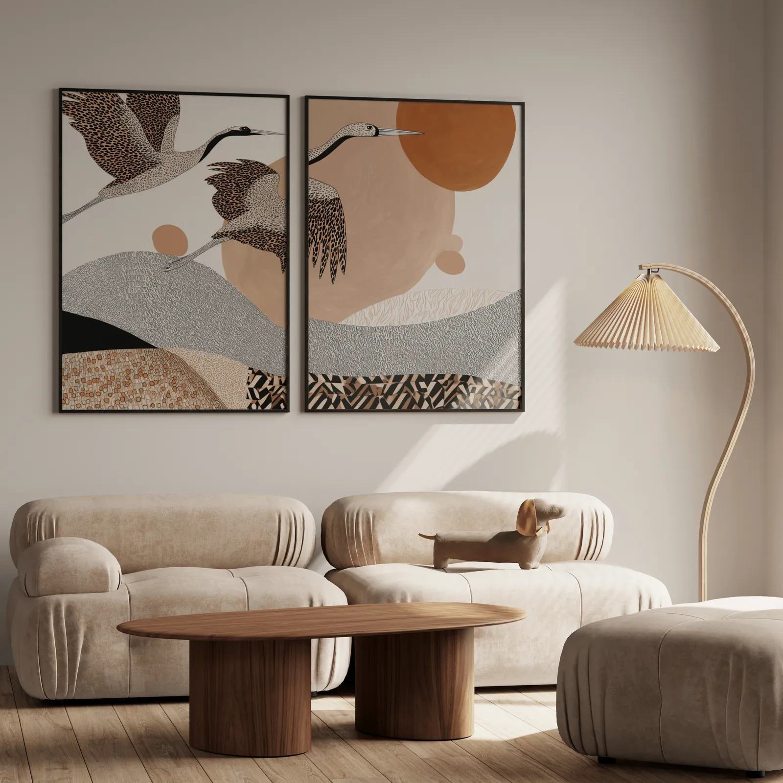 terracotta crane wall art set of two abstract landscape prints, above a plush beige sofa with a pleated lamp nearby