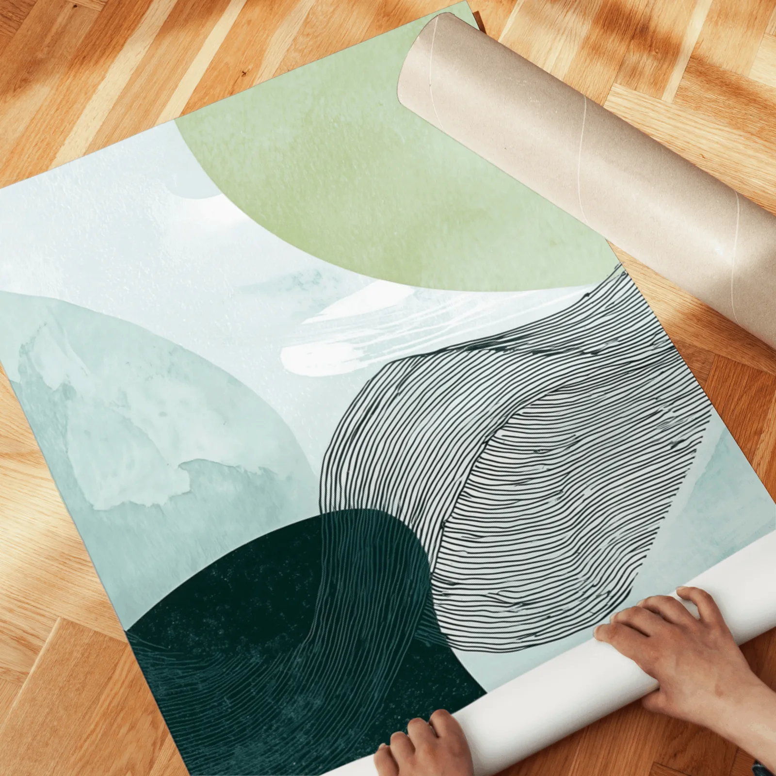 blue green abstract three panel wall art set, unrolled across a herringbone wood floor by hand