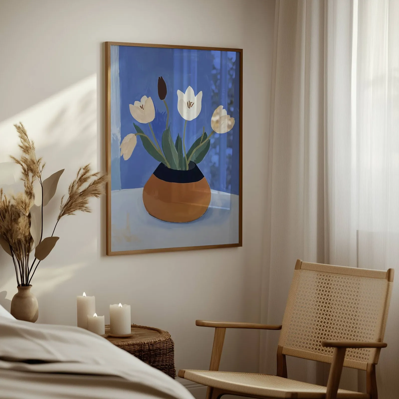 white tulips in terracotta vase botanical wall art, above a woven side table with lit candles and pampas grass